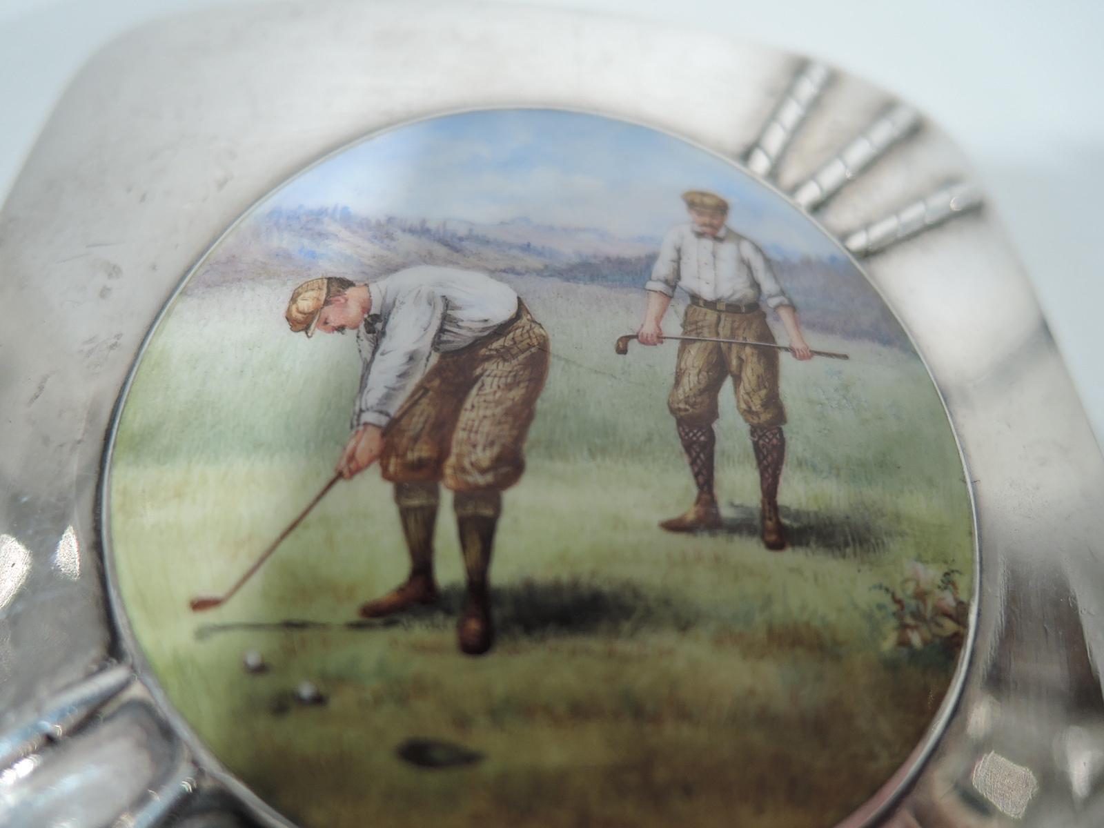 American Edwardian sterling silver and enamel cigarette case. Squarish with curved corners. Cover inset with three applied clubs and central enamel painting depicting a pair of stooped and concentrated golfers in plus-fours and flat caps