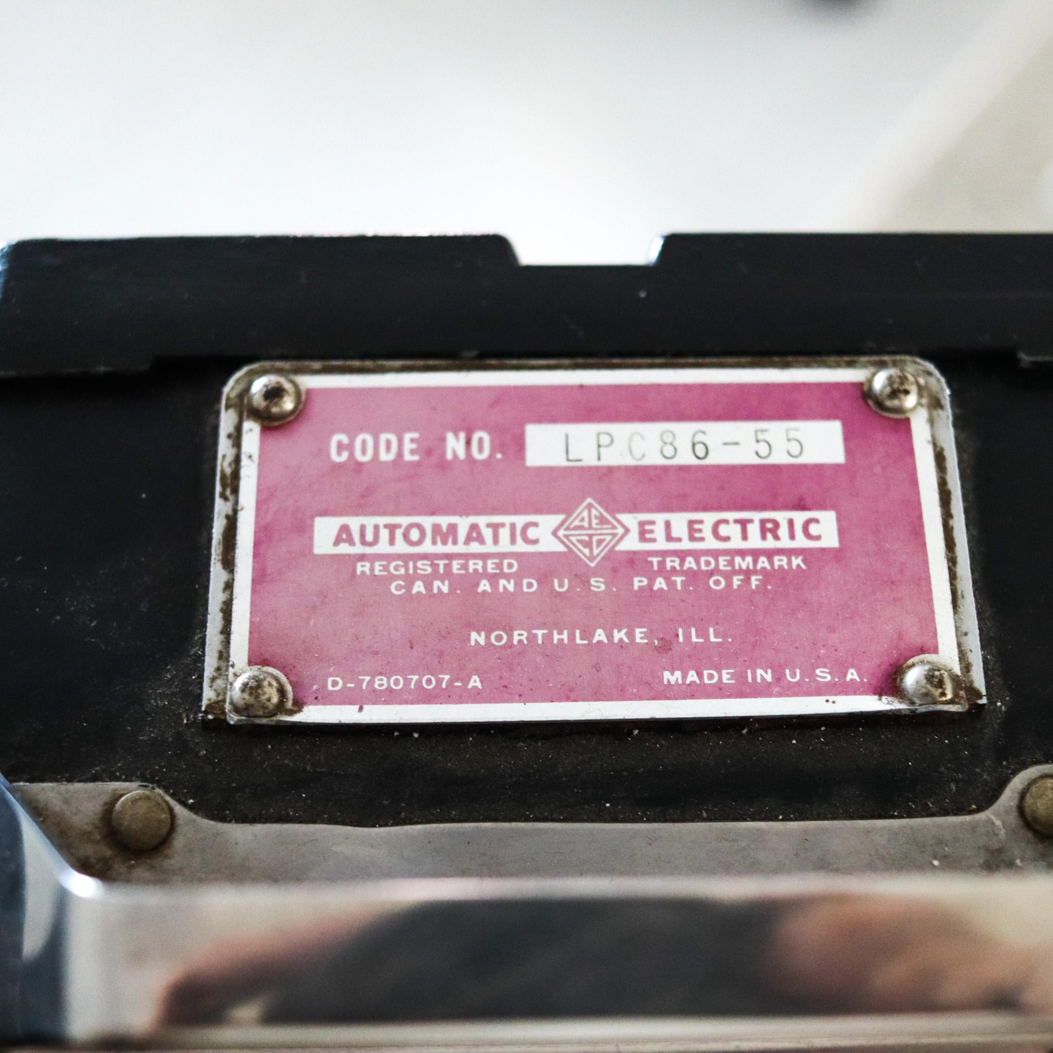 American Electric Company 1940 Münze Wandtelefon schwarz aus massivem Stahl (amerikanisch)