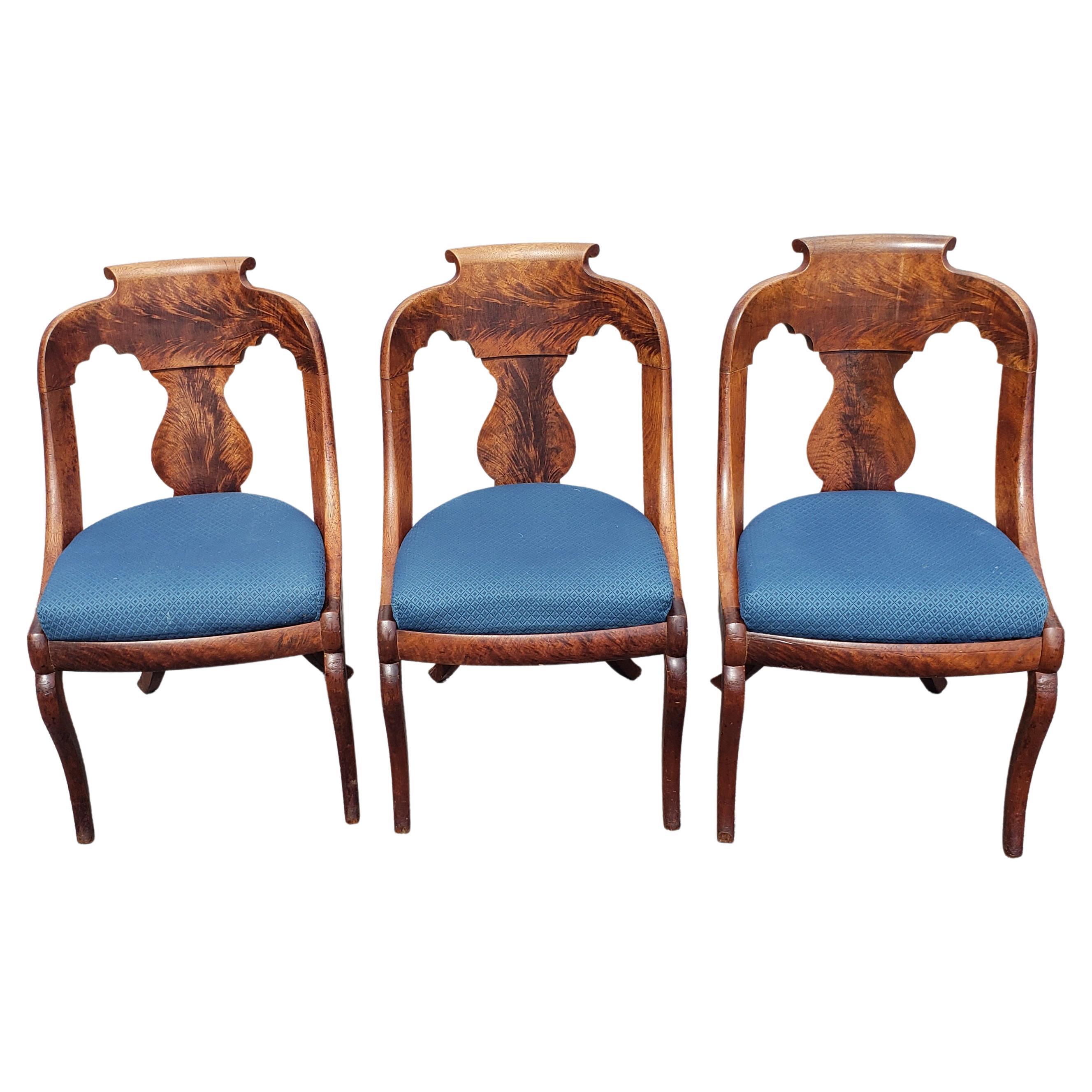 Exceptional set of 3 American empire Boston girandole chairs. This very rare chairs in today's market was handcrafted out of top grain flame mahogany in mid 1800s. These grandiose chairs evolved from French Empire designs and were made only in the