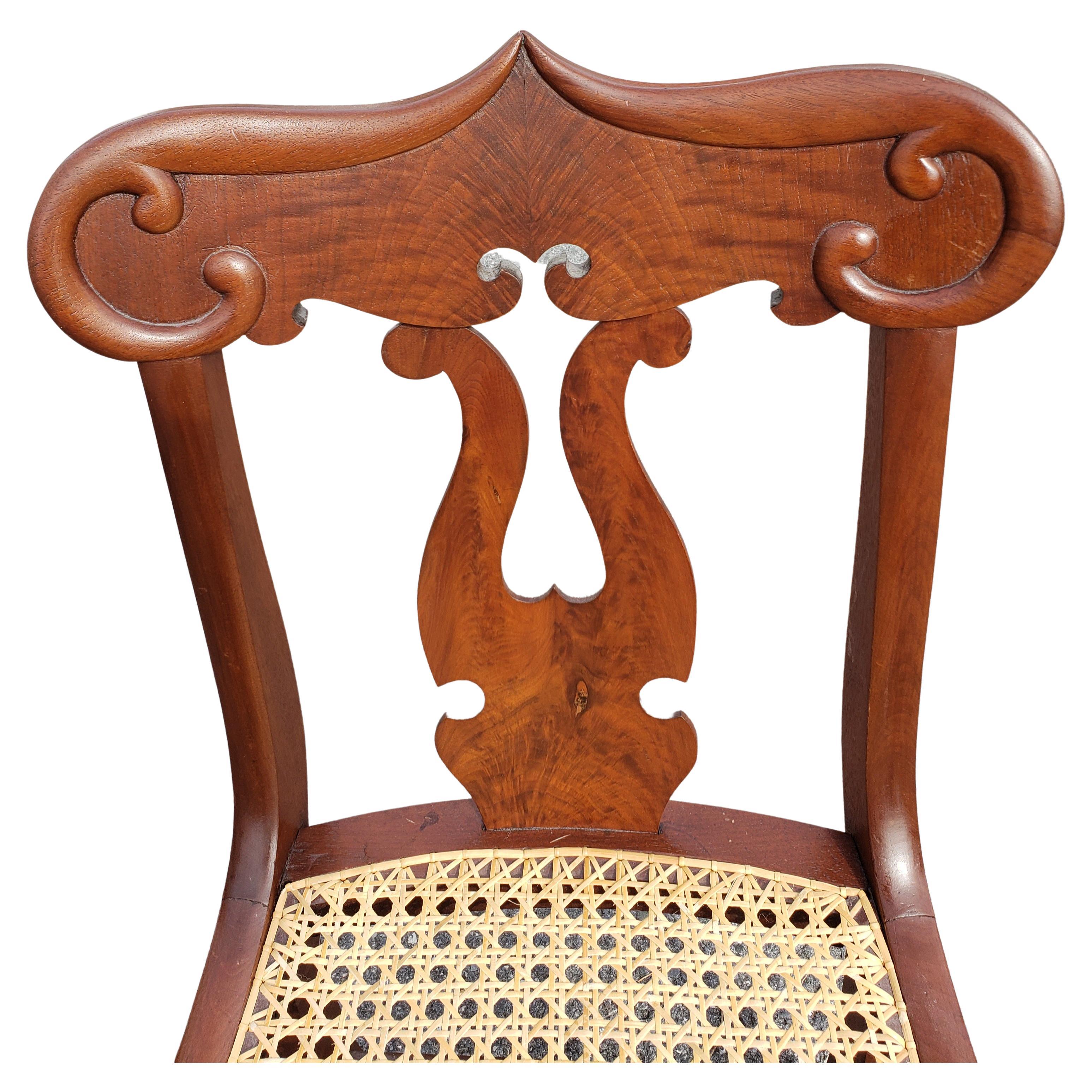 Hand-Carved American Empire Flame Mahogany Cane Seat Chairs, circa 1890s a Pair For Sale