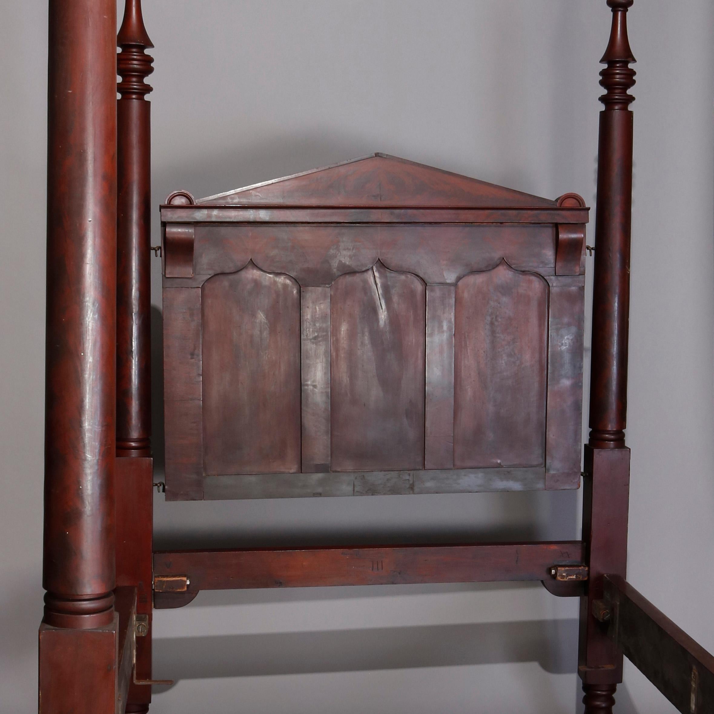 An American Empire Quervelle school tester poster bed offers flame mahogany construction with architectural paneled headboard and turned posts surmounted by spire form finials, accepts full size mattress, circa 1840

***DELIVERY NOTICE – Due to