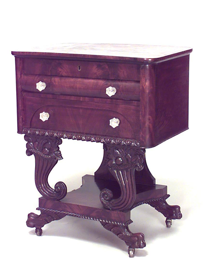 American Empire mahogany flip top sewing table on cornucopia carved legs with interior mirror and compartments (attributed to ANTHONY QUERVELLE)
