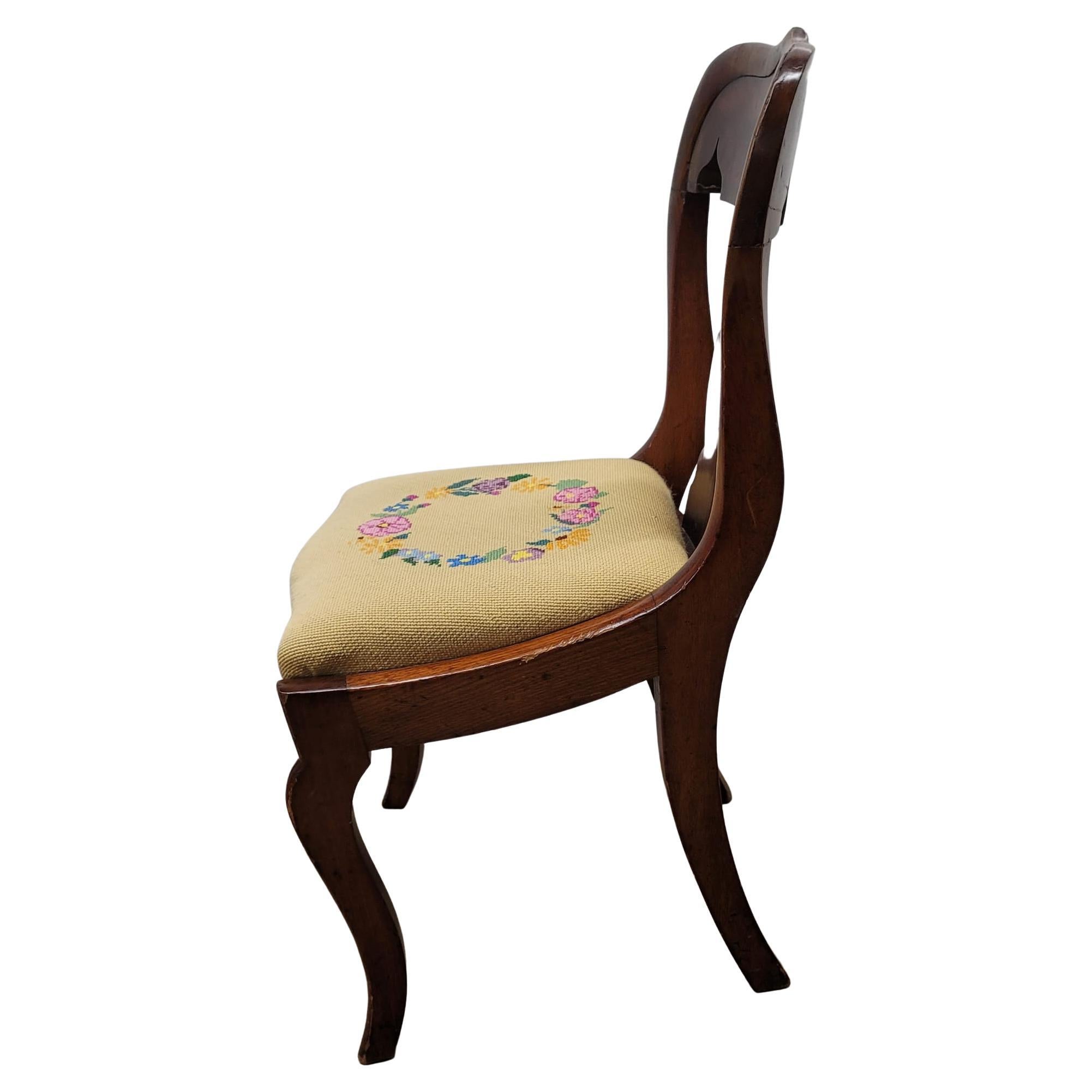 Recently needlepoint reupholstered American Empire mahogany side chair. 
Measures 19