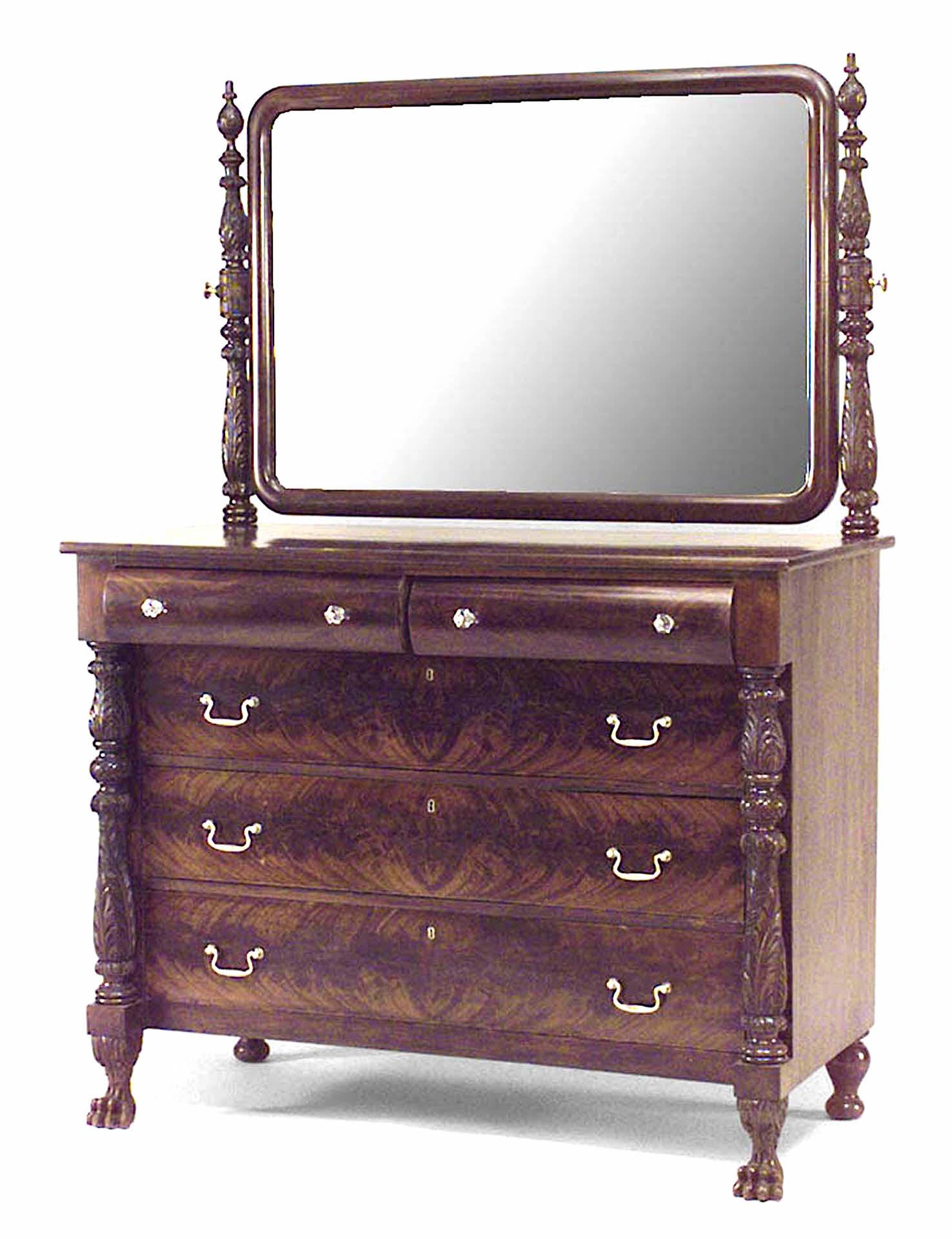 American Empire mahogany chest of drawers with carved pineapple finials and sides with swivel mirror top.
