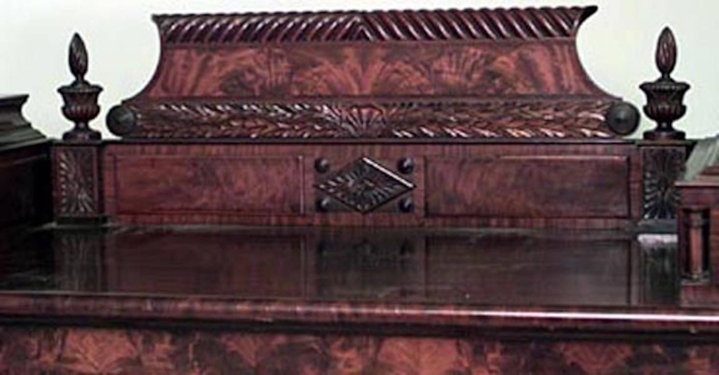 American Empire mahogany double platform sideboard cabinet with 4 carved swirl columns and backrail with finials.
