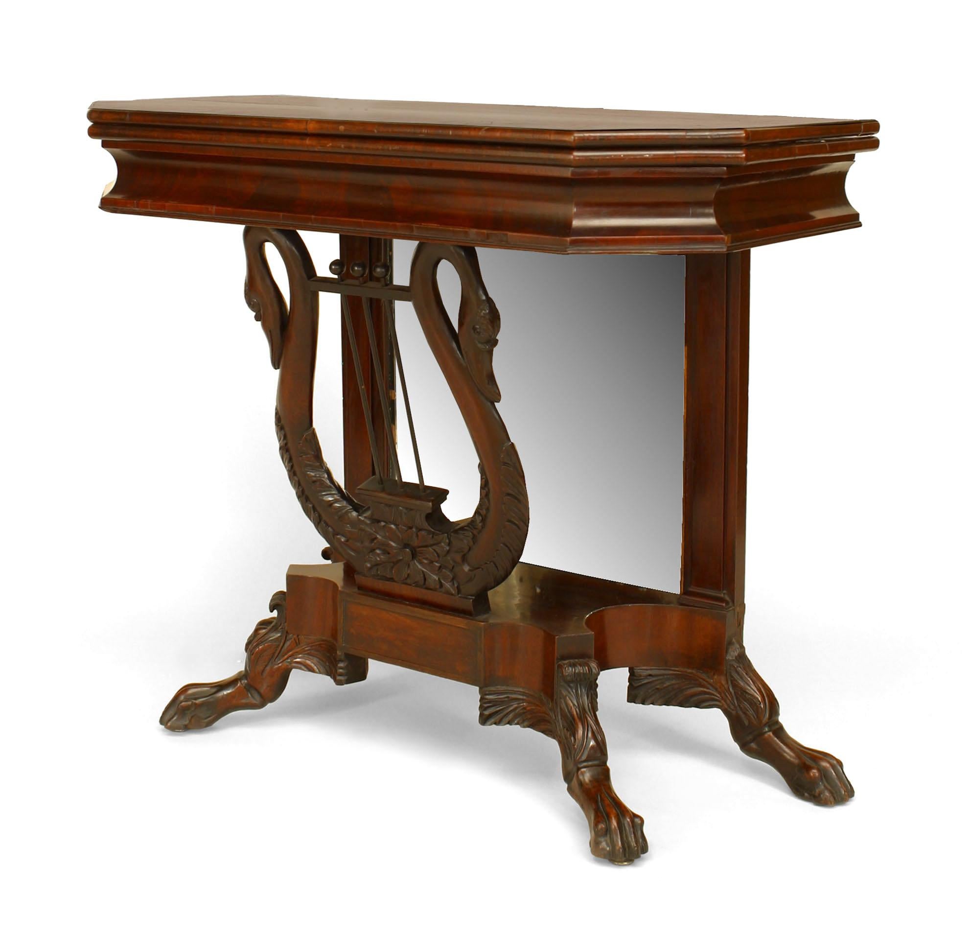 American Empire mahogany flip top console table with mirror back and lyre and swan base.
