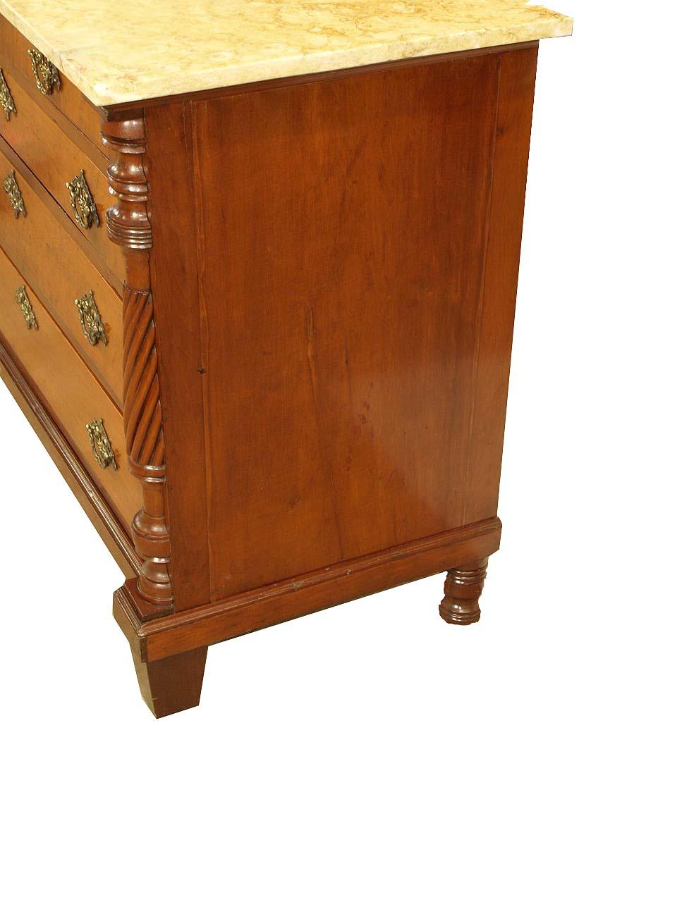 American Empire marble top chest, with beautiful figured marble, the two over three graduated drawers with ornate brass pulls and escutcheons are veneered with bird's eye maple, the rest of the chest is mahogany. The stiles feature applied pilaster
