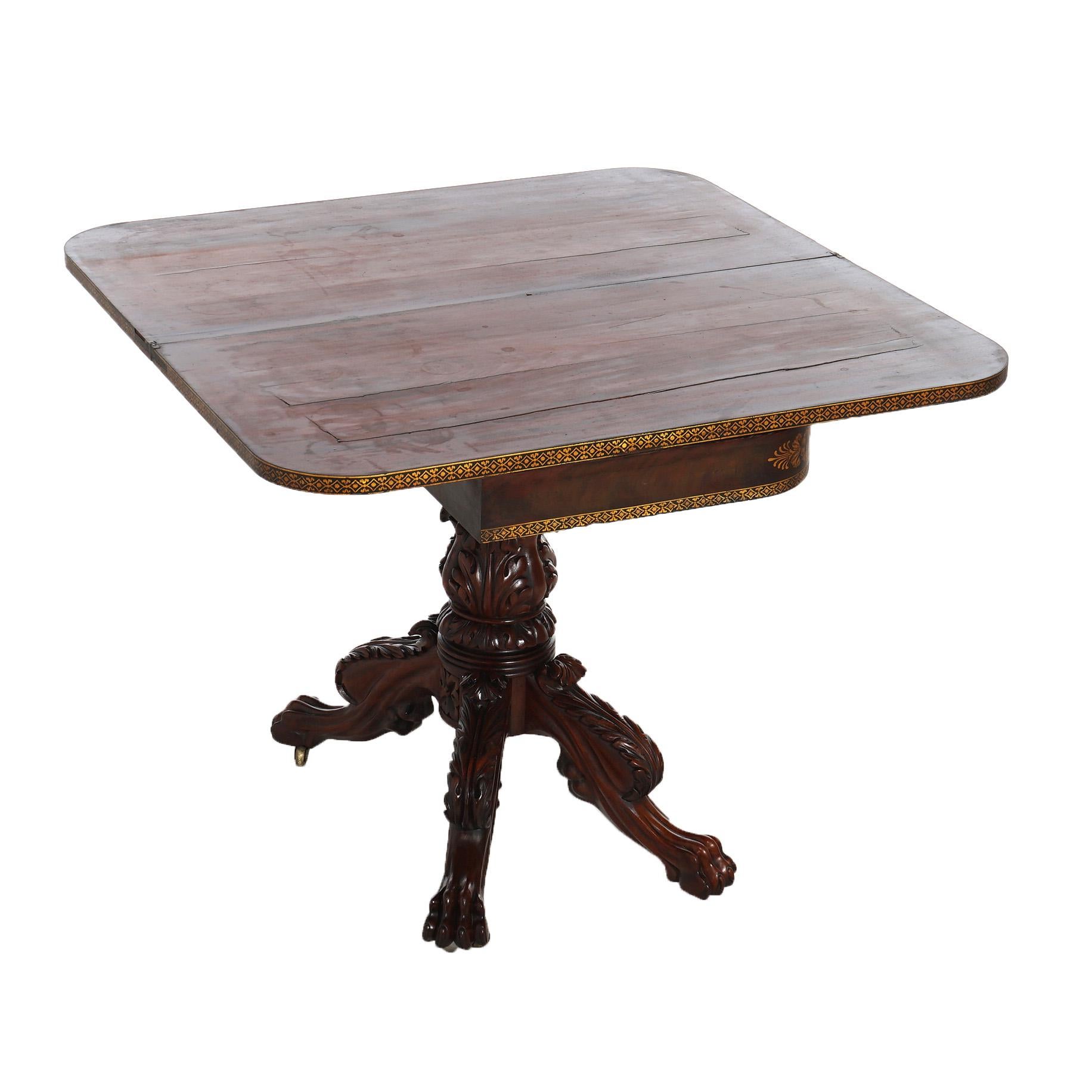 ***Inquire About Reduced In-House Delivery Rates - Reliable Professional Service & Fully Insured***
American Empire Mahogany Game Table in the Manner of Quervelle with Foliate Carved Elements, Turned Pedestal & Gilt Stenciled Decoration,