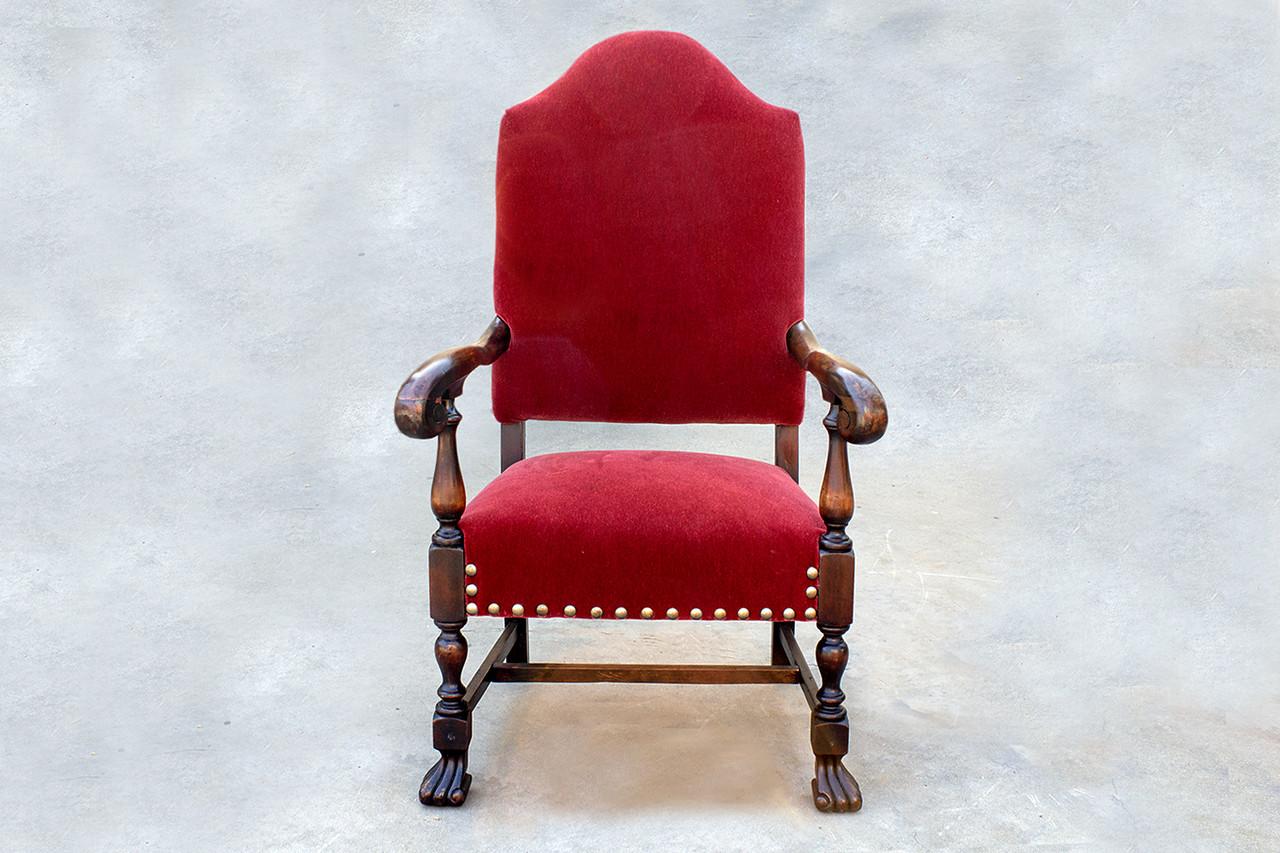 American Empire style armchair with tapered high back and ornate mahogany frame. This statement piece features reconditioned wood paired with rich red mohair upholstery. C. late 19th century.

Dimensions: 27