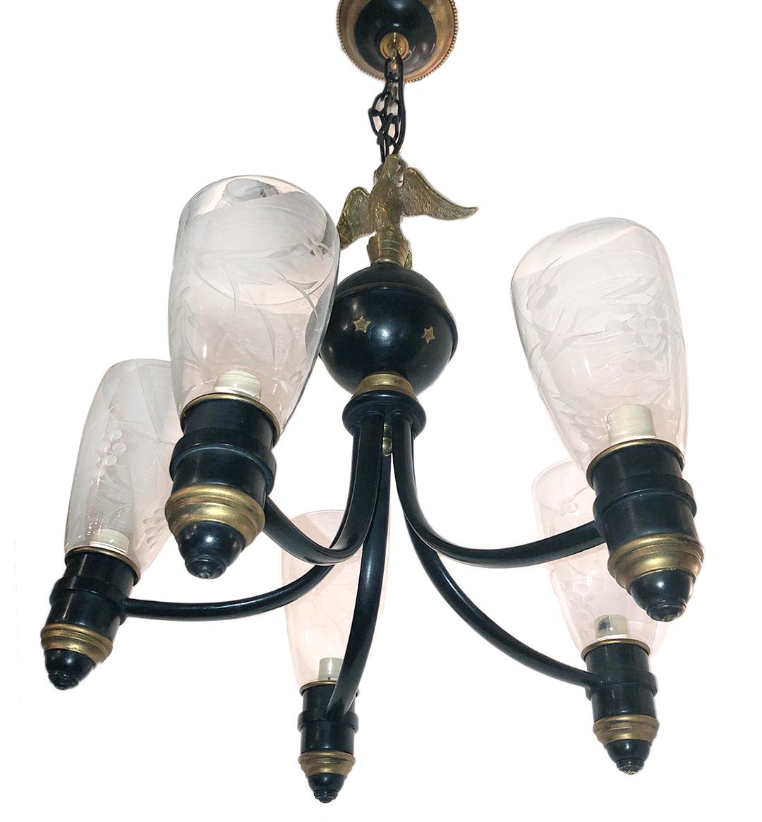 A circa 1940s American bronze chandelier with painted finish and original etched glass hurricanes.

Measurements:
Minimum drop 24