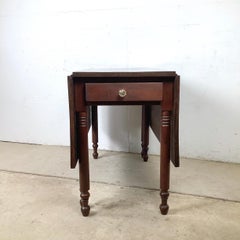 Table de salle à manger de style Empire en noyer à feuilles tombantes et à pieds en forme de porte