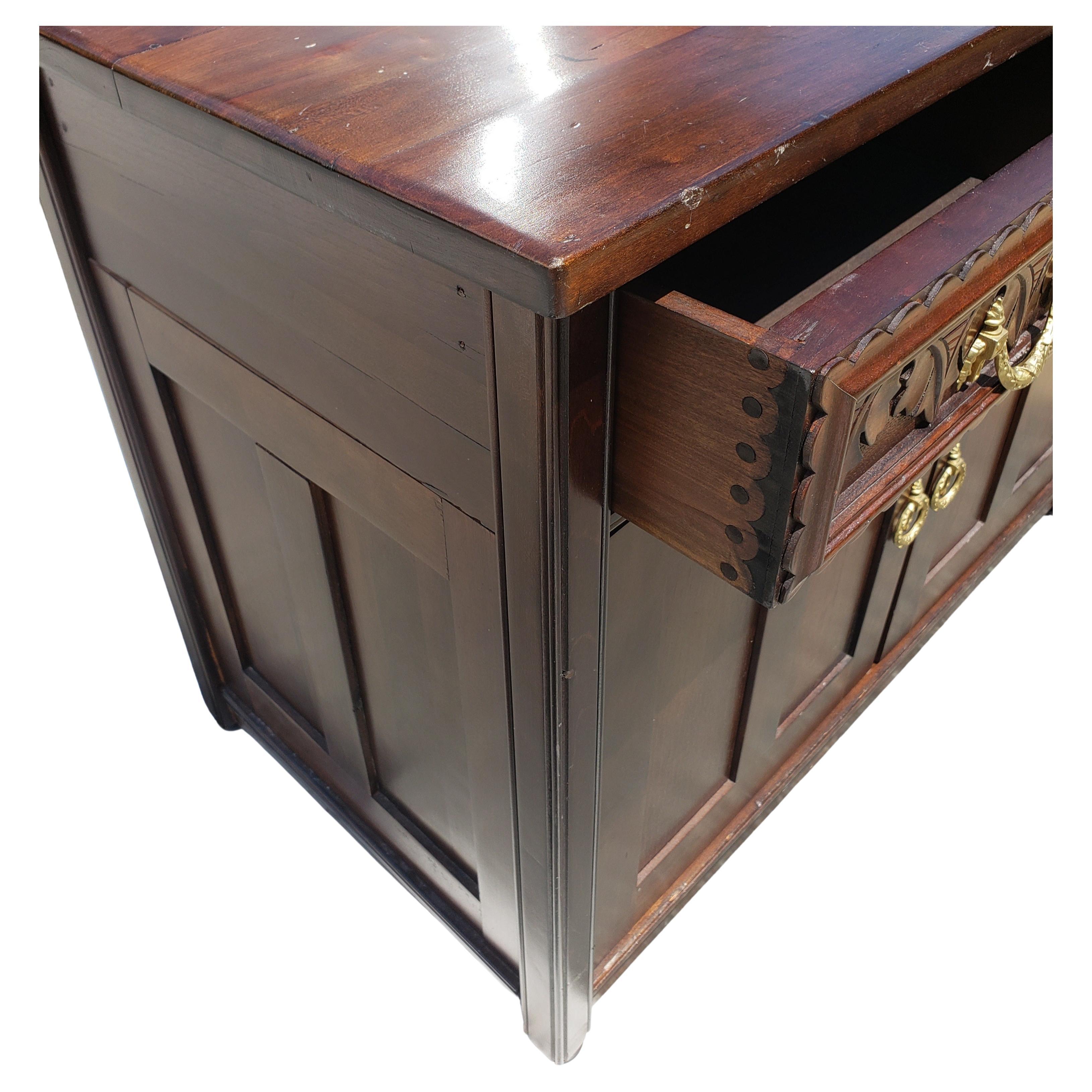 Absolutely beautiful American Empire Walnut credenza server cabinet with two drawer with exquisitely handcarved front.
This beautiful piece may be used in any dining area in your home.
It is in good condition and has been refinished. Shows aged