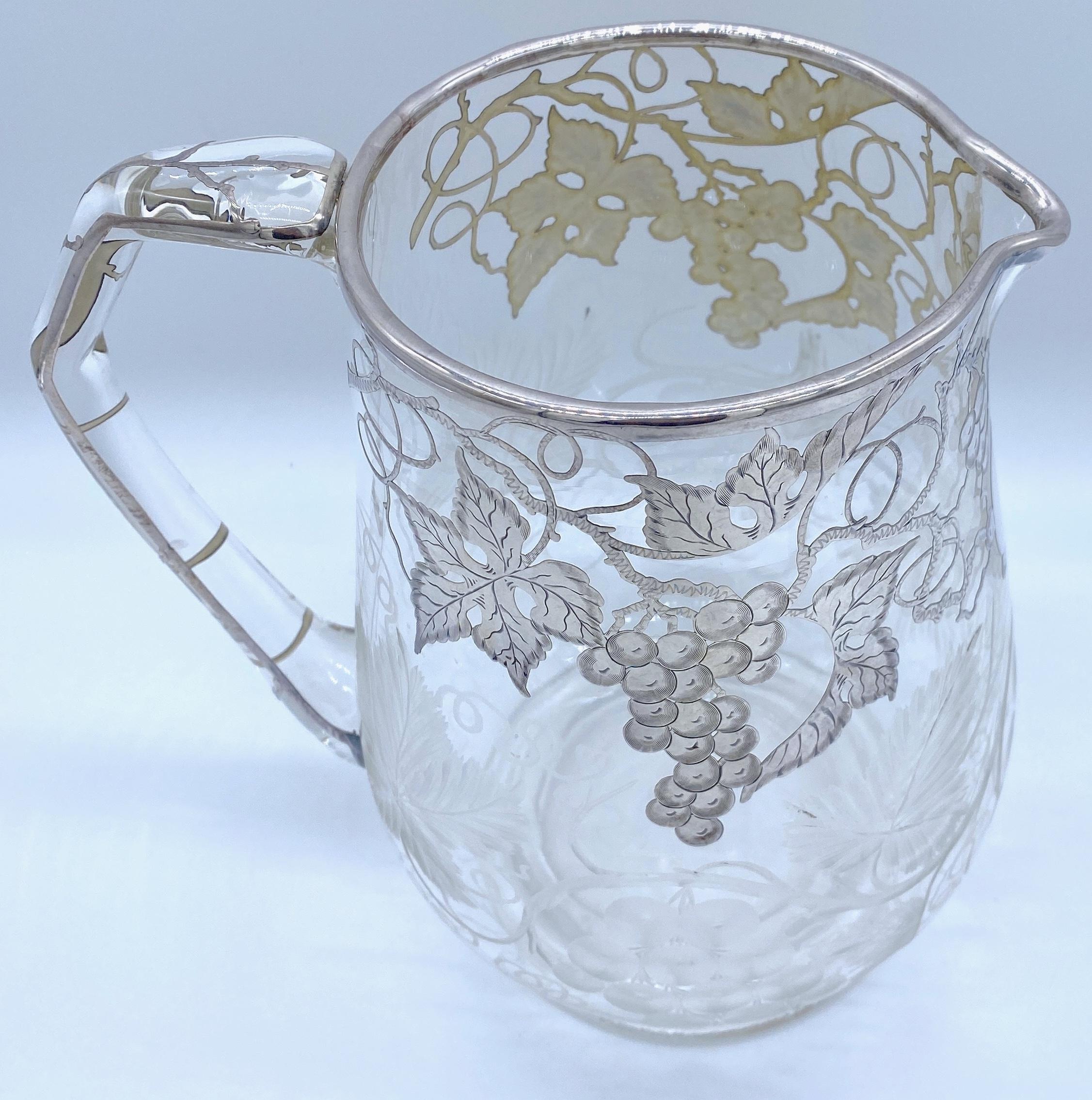 American Engraved Grape Motif & Silver overlay Crystal Pitcher, Possibly Hawkes
Unmarked, Circa 1900

Indulge in the timeless elegance of this American Engraved Grape Motif & Silver overlay Crystal Pitcher, pos attributed to Hawkes, dating back to