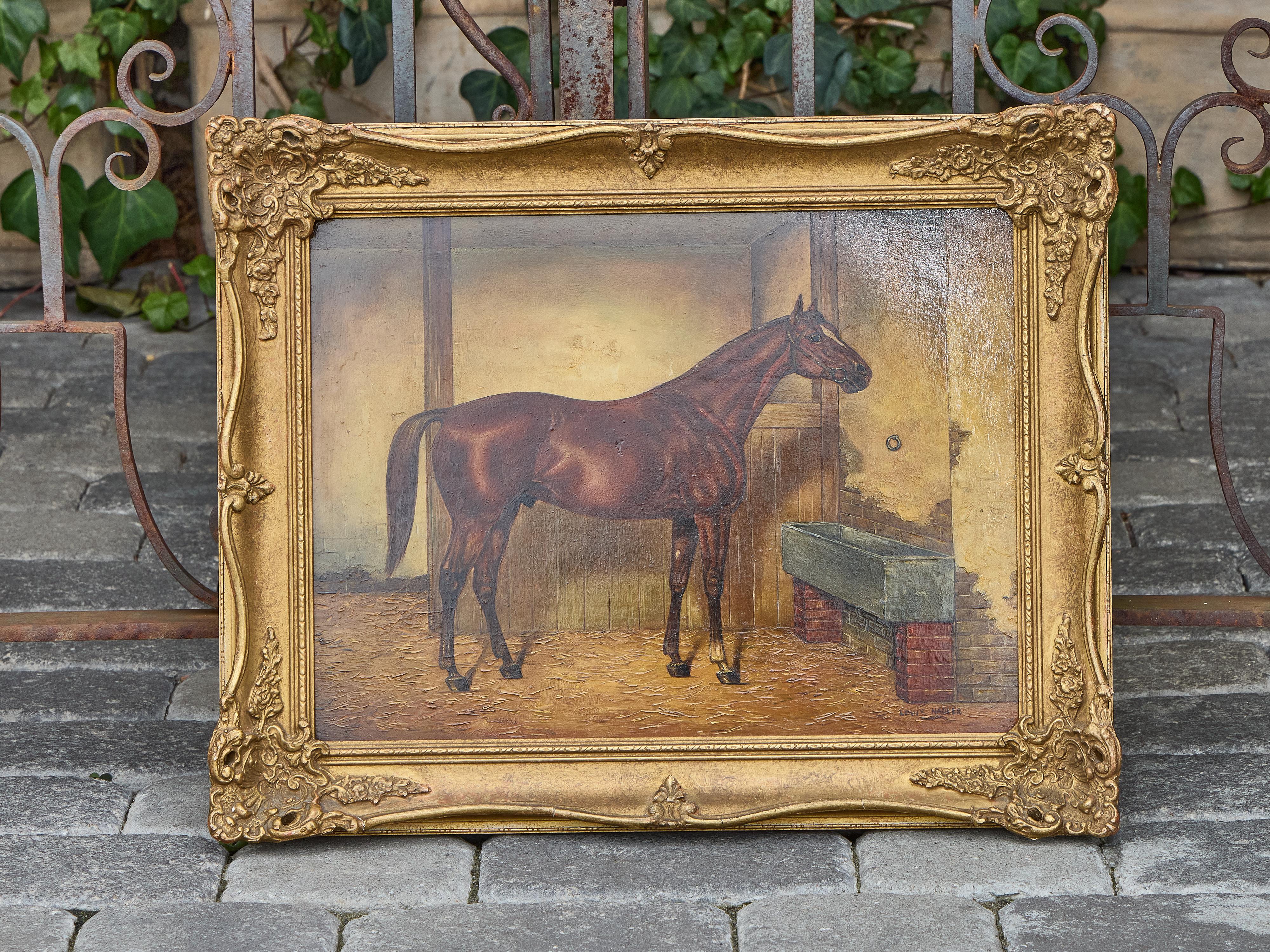 A finely rendered equestrian portrait, this early 20th-century American oil on board captures the striking presence of a chestnut racehorse standing in its stable. The animal is presented in profile, its musculature clearly defined beneath a glossy