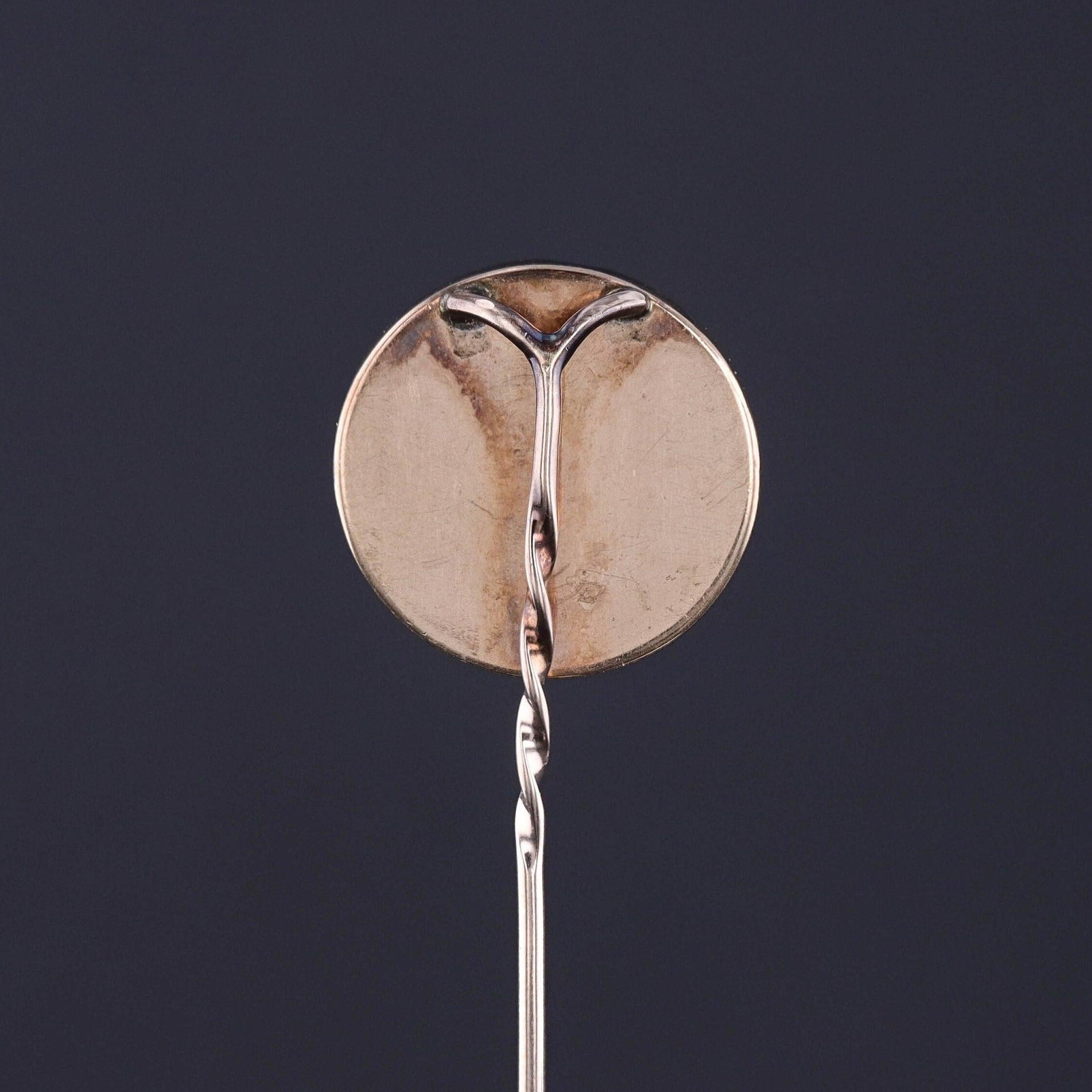 Antique Reverse Painted Crystal Dog Stickpin: A beautifully detailed reverse carved, hand painted Pomeranian or American Eskimo dog stickpin. The polished domed crystal piece is set in 9ct gold and dates to the late 1800s (circa 1880-1900). 

The