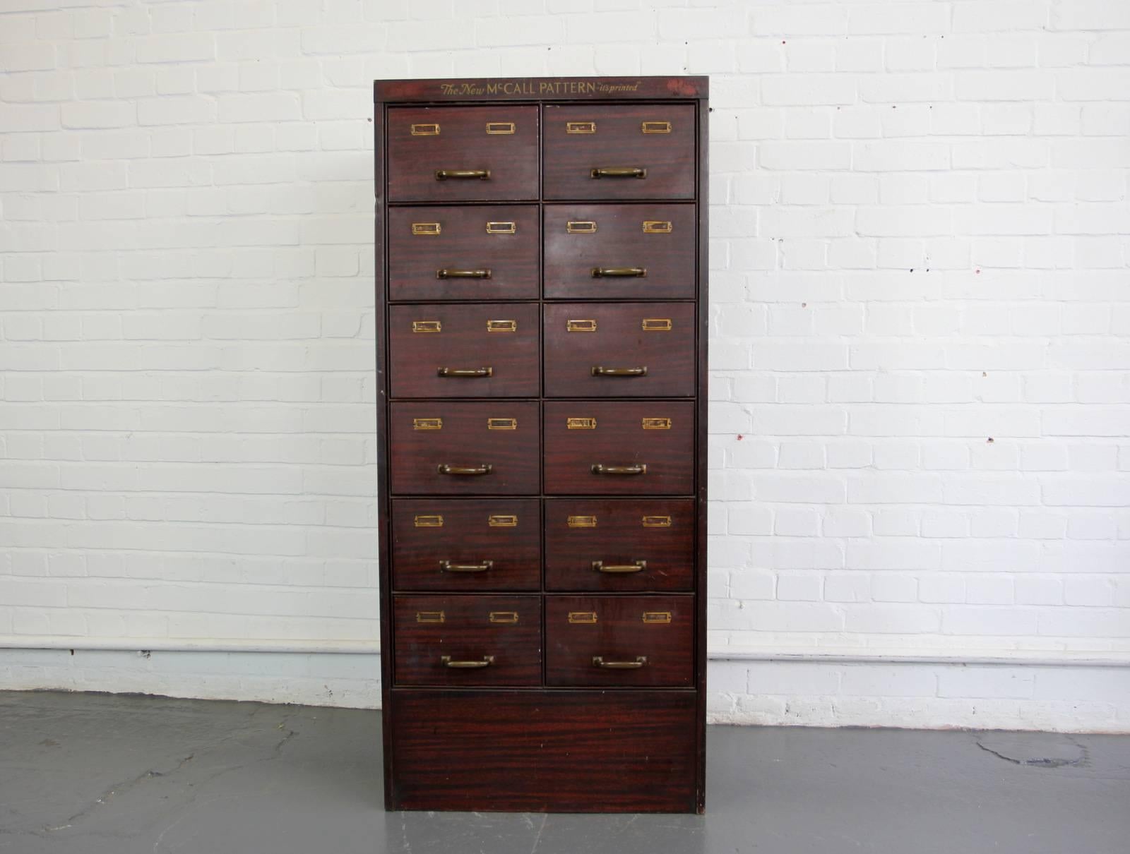 American faux wood sewing drawers, circa 1910

Product code #OA518

- Brass handles and card holders
- The cabinet is made from sheet steel with faux wood finish
- Original sign written logo
- 12 drawers 
- American, circa 1910
- Measure: