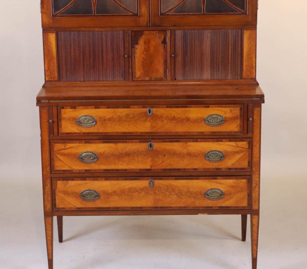 American Federal Birch and Birch Inlaid Secretary Bookcase.  Northern New England.  Flame birch panels, tambour front, arched top, classical fenestration.
Early 19th Century and later

Provenance:  Kennebunkport, Maine Private Collection