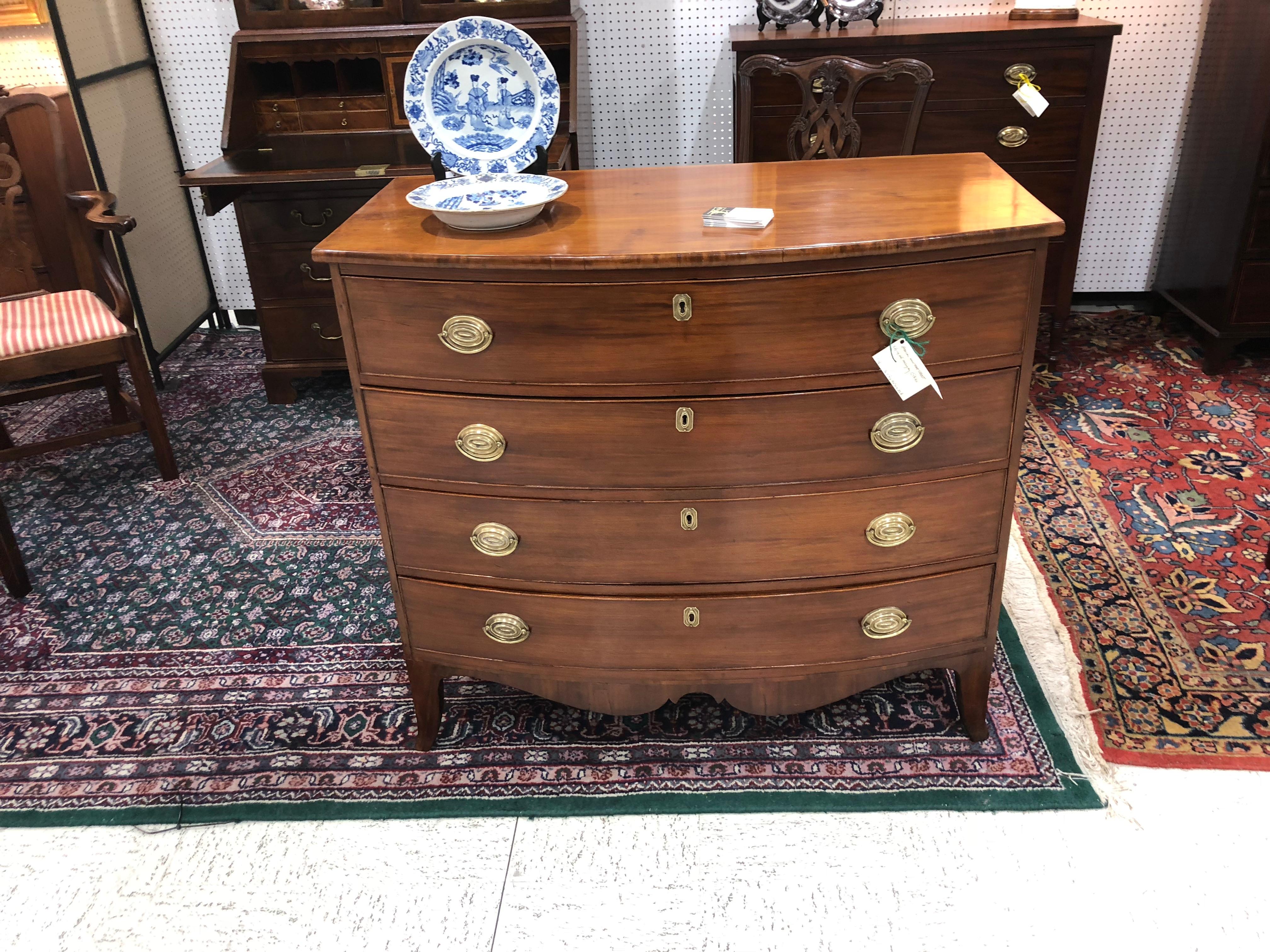 American federal bow front chest, circa 1820, cherry and mahogany, excellent light color, beautiful skirt and tall feet, drawers work well, period brass ovals, beautiful finish, nice size, not too tall, an elegant chest.