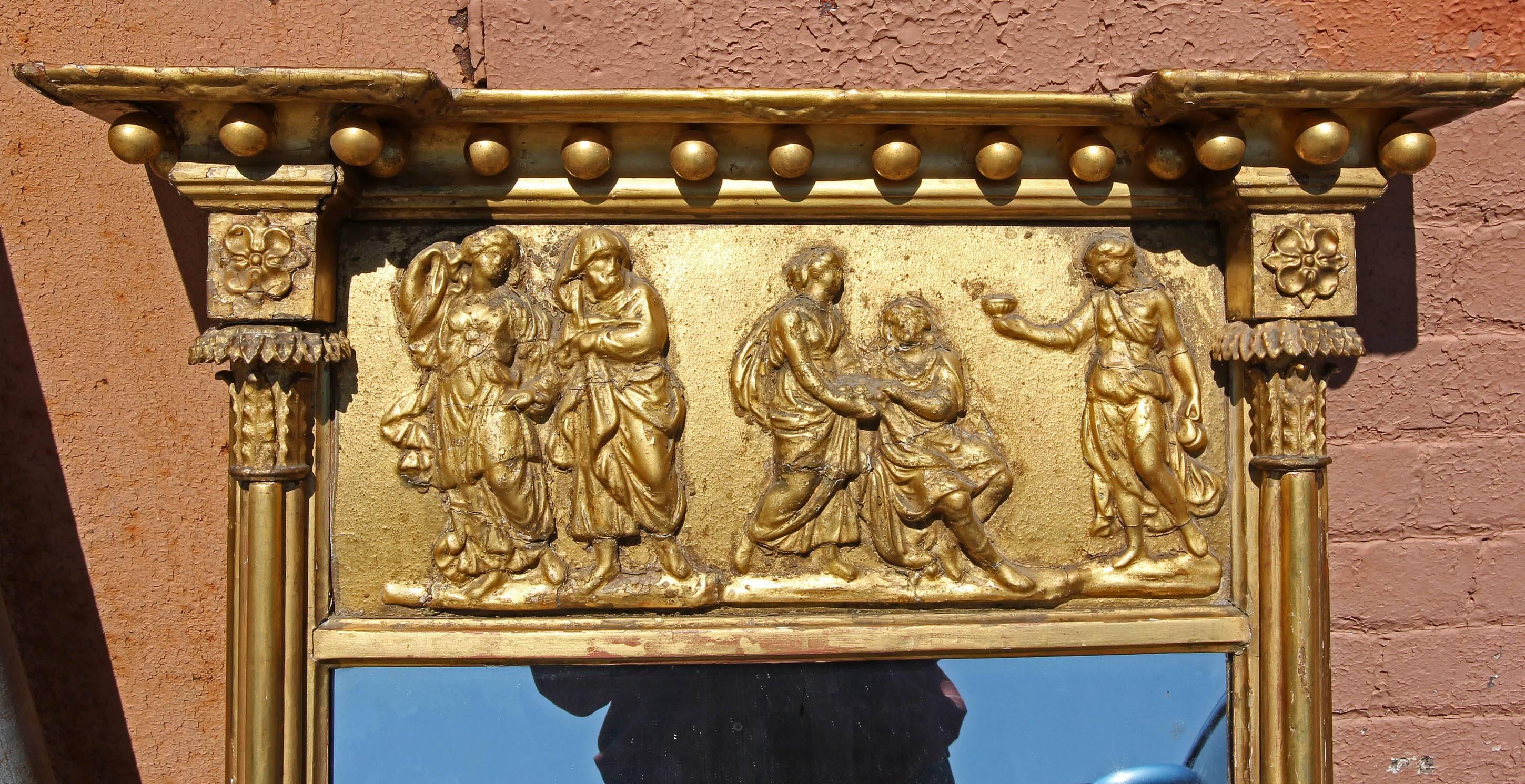 Antique American Federal console mirror with panel decorated with classical figures. Gilt gesso, circa 1810.