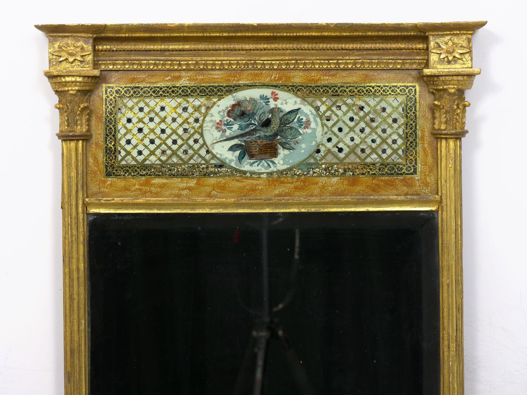 A powerful Federal period example, this pier mirror is a fine display of Neoclassicism in the first quarter of the 19th century. The tasteful decoration of the surfaces throughout is notable for its sheer variety and imaginative qualities. There is