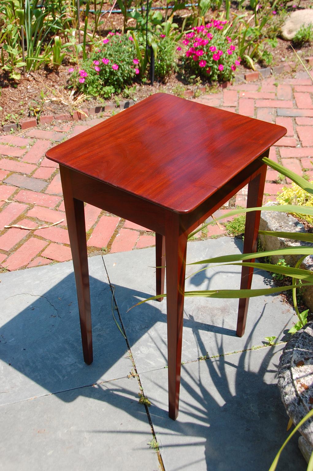 American Federal period Hepplewhite one drawer mahogany sidetable. This classic form has tapered mahogany legs, elegant thin solid mahogany top and one dovetailed drawer. It can freestand as it is finished on all sides. Circa 1790.