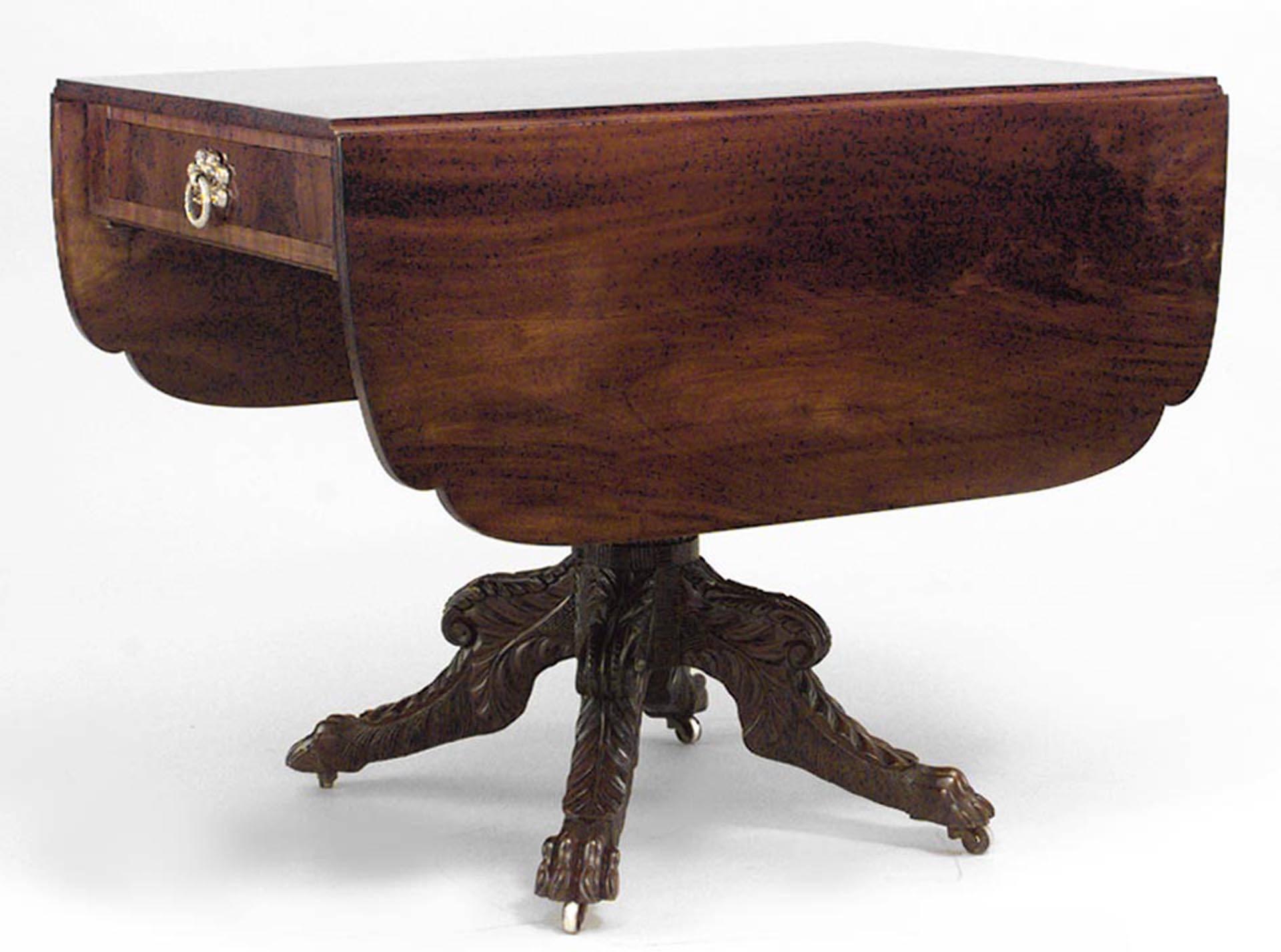 American Federal (Mid-19th Century) mahogany Pembroke table with re-entrant cornered top above a frieze drawer, an acanthus-carved stem & legs with lions paw feet & casters.
