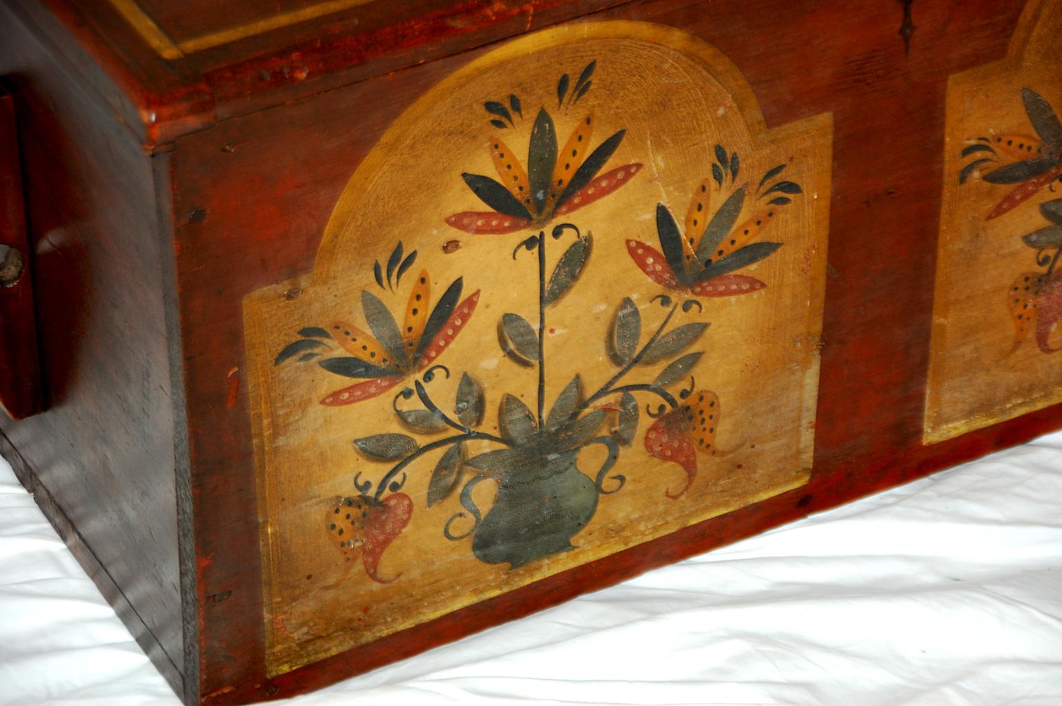 American federal period Pennsylvania Dutch six board pine chest or trunk with original painted decoration and interior candle box. Provenance available to purchaser, circa 1790.