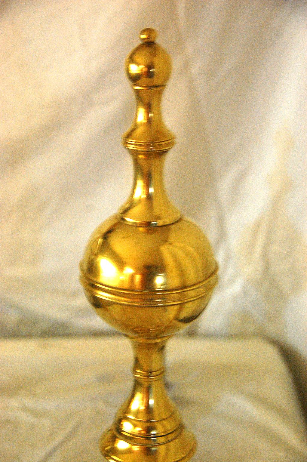 American Federal period brass fireplace andirons, belted ball tops with balled spires, Signed R. Wittingham, N(ew) York, cast and seamed. R. Wittingham was an accomplished brass producer in New York from 1795-1818. At 22 Inches high these are