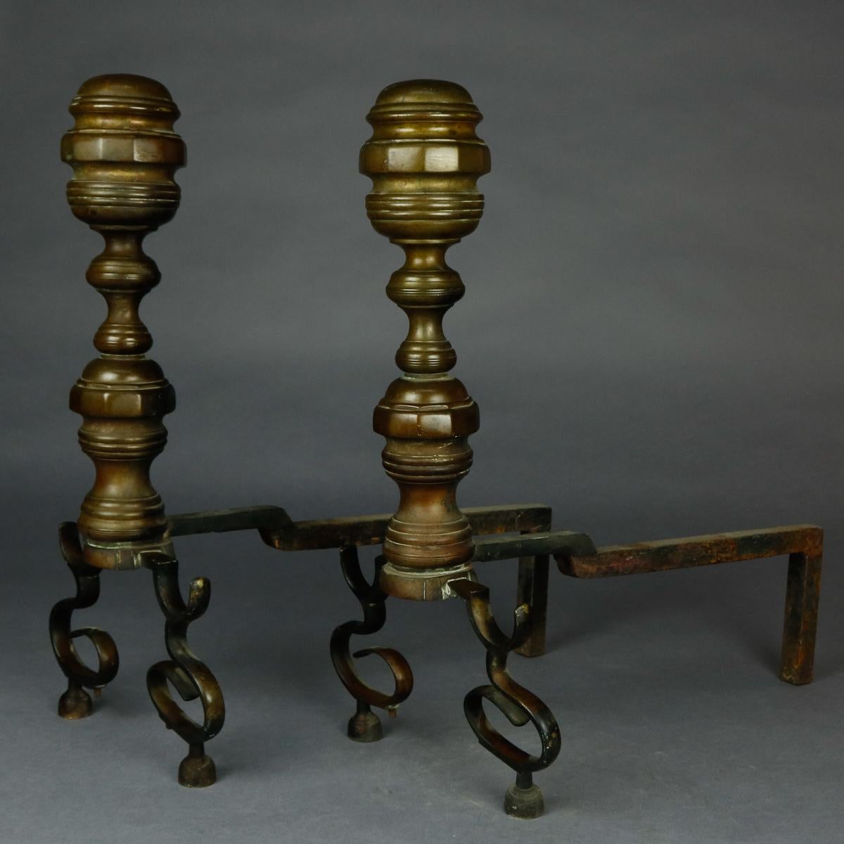 A set of American Federal Philadelphia style brass fireplace andirons offer brass beehive form with faceted elements, iron firedogs and raised on scroll form feet, circa 1850

***DELIVERY NOTICE – Due to COVID-19 we are employing NO-CONTACT