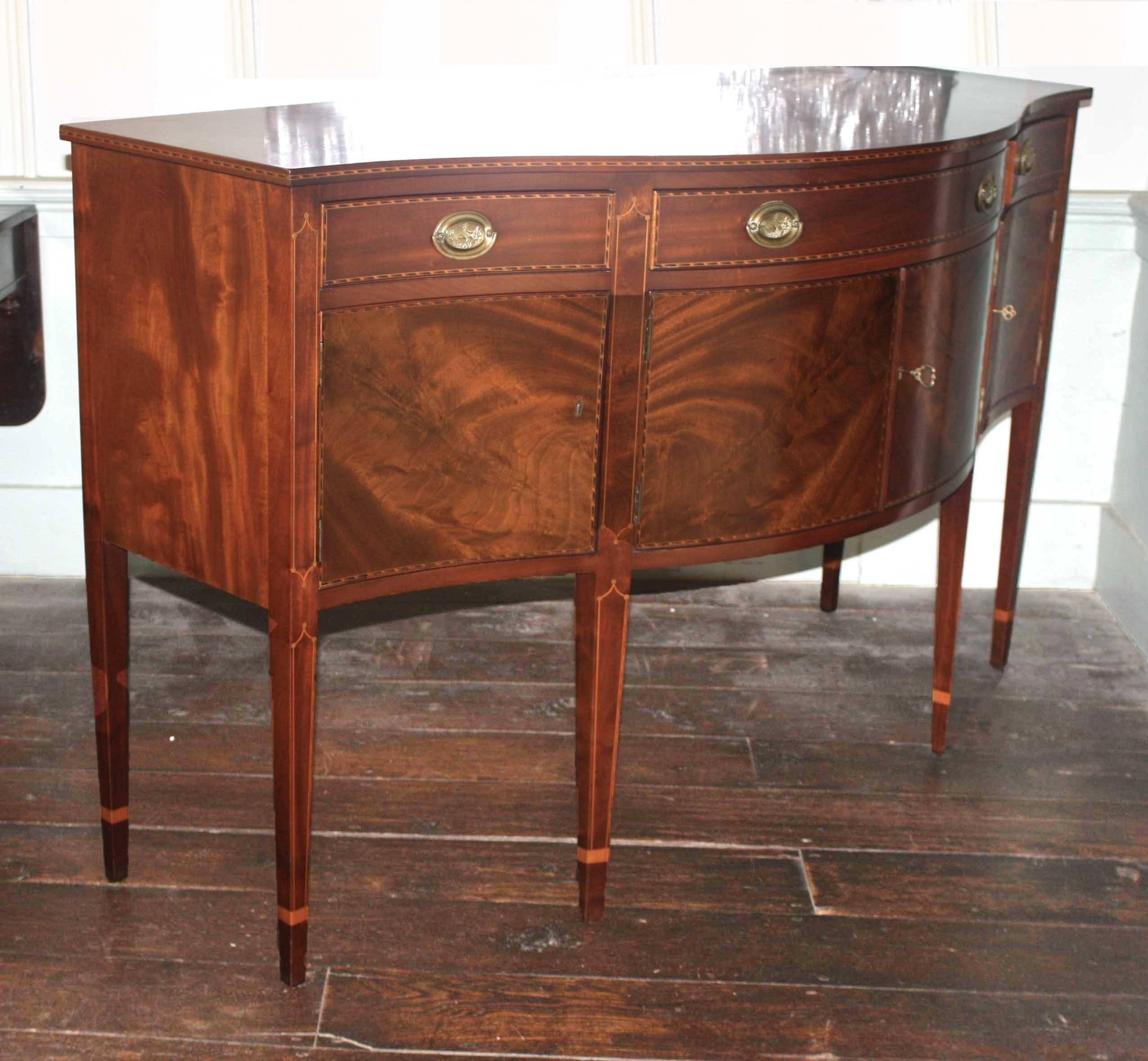 In the spirit of the American Centennial celebration, a meticulously detailed and inlaid, outstanding bench-made specimen. The four crotch mahogany cabinet doors are symmetrically matched; with working key locks. Original shellac finish and rare