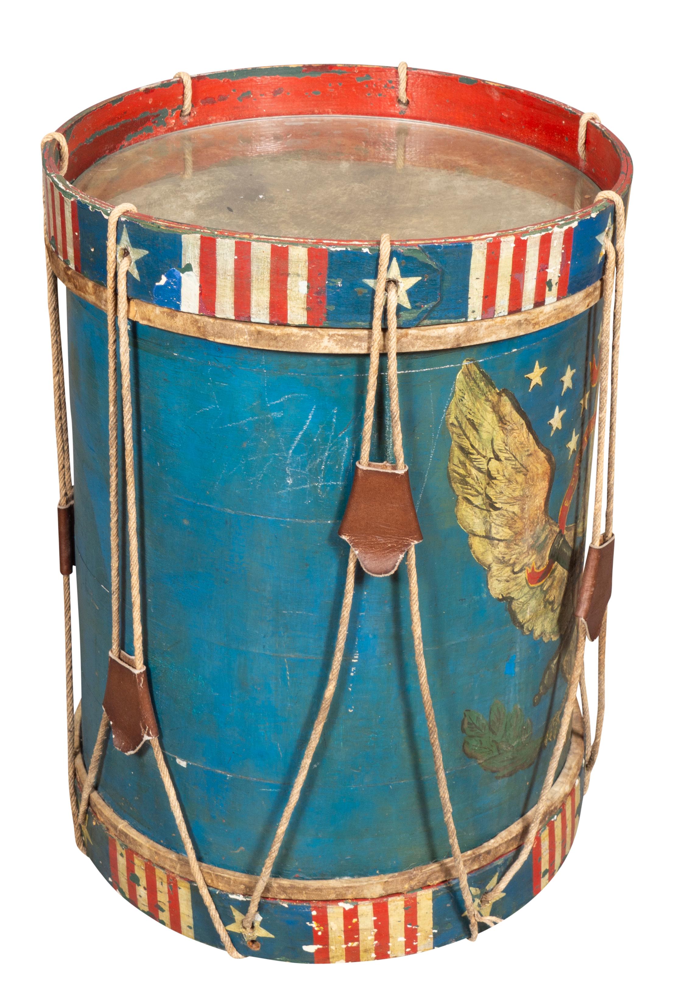Cylindrical with a painted shield with thirteen stars with overall red,white and blue decoration. Vellum under glass top.