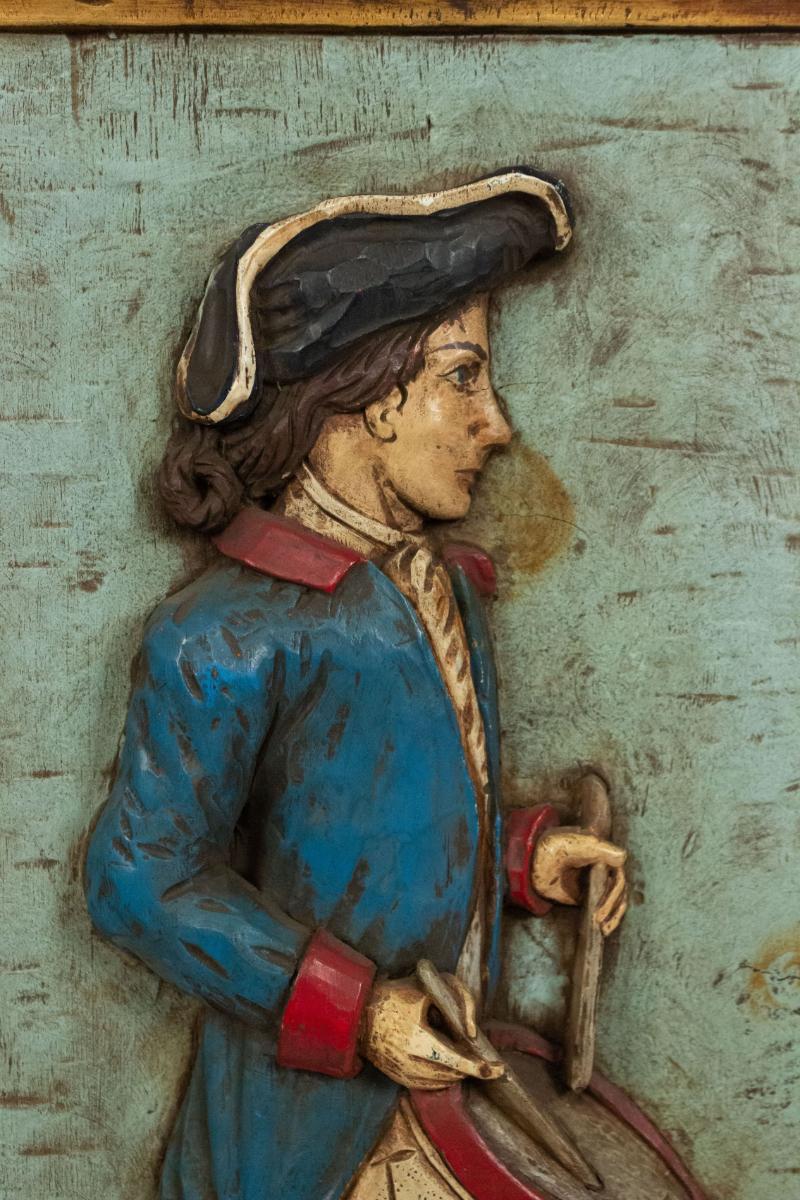 American Country style (20th Century) carved and painted wall plaque of Revolutionary soldier with drum. (Related Item: 036345D).