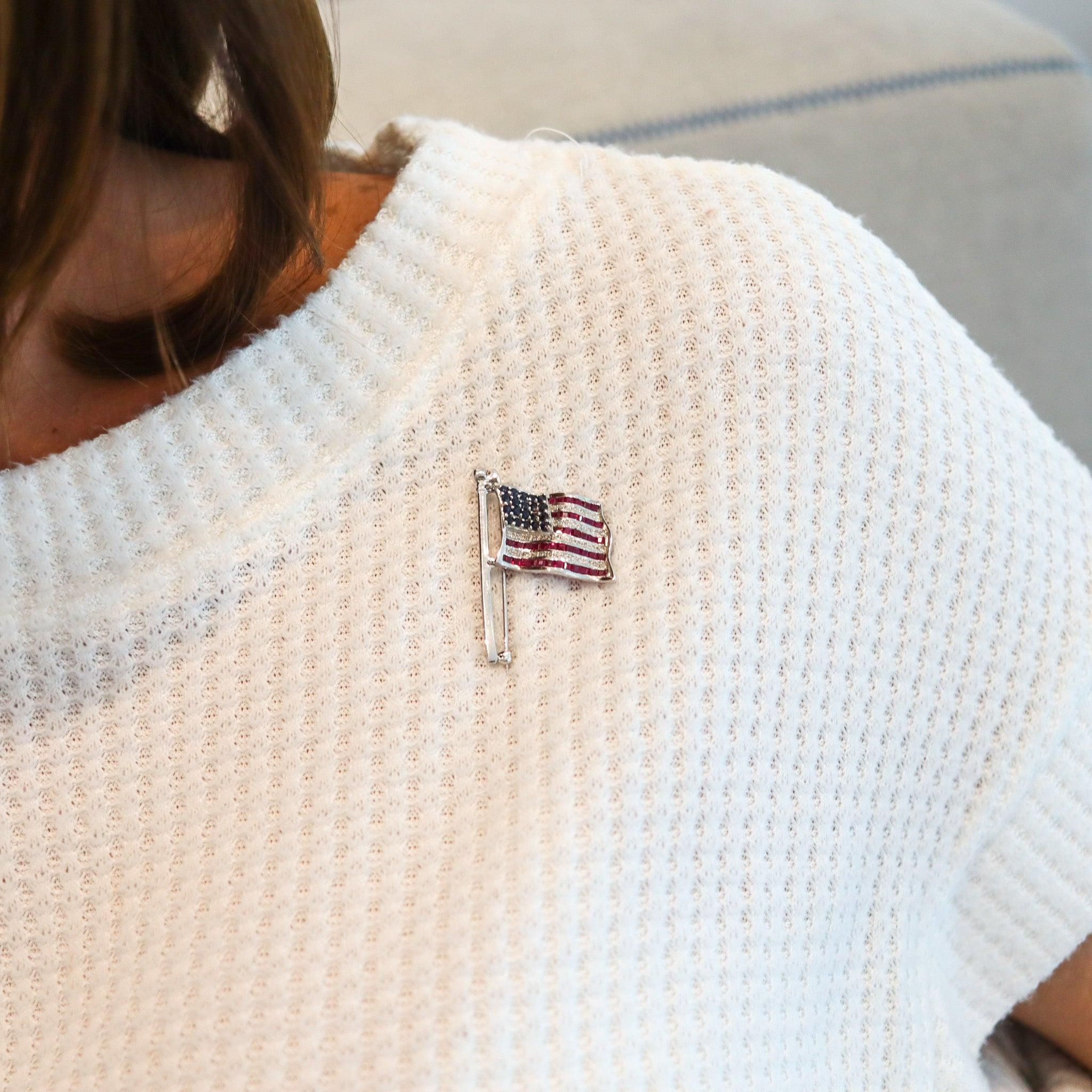 American flag convertible brooch.

Very beautiful American flag brooch, created in the United States back in the 1970's. This patriotic brooch, has been carefully crafted in the shape of the United States Of America flag, in solid white gold of 14