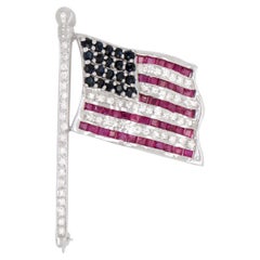 Broche drapeau américain en or 14 carats avec rubis, saphirs et diamants
