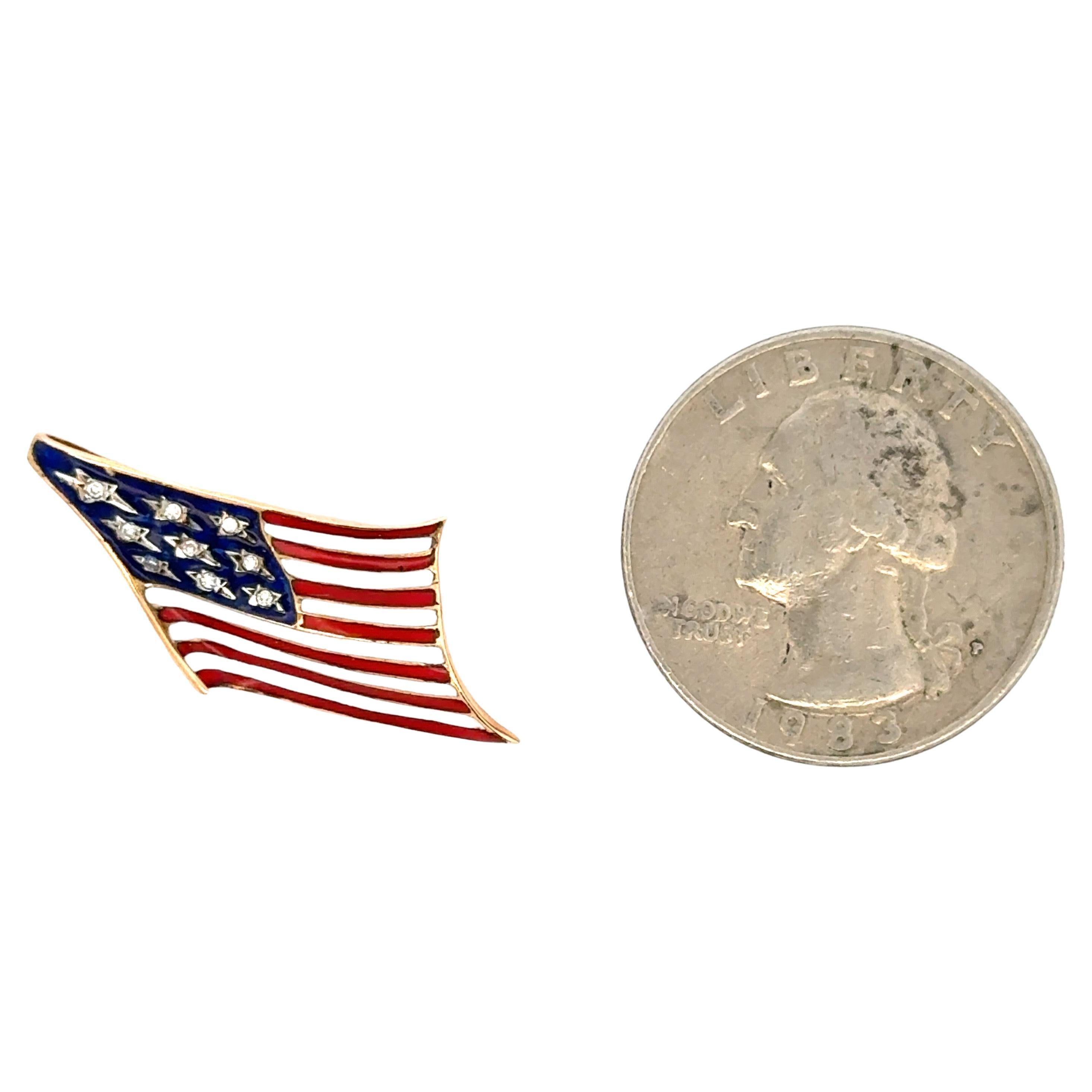 14 Karat yellow gold American Flag featuring 9 diamonds and Red, White & Blue enamel, 2.4 grams. Can be worn as a pendant or brooch. 

More American Flags available
Search Harbor Diamonds