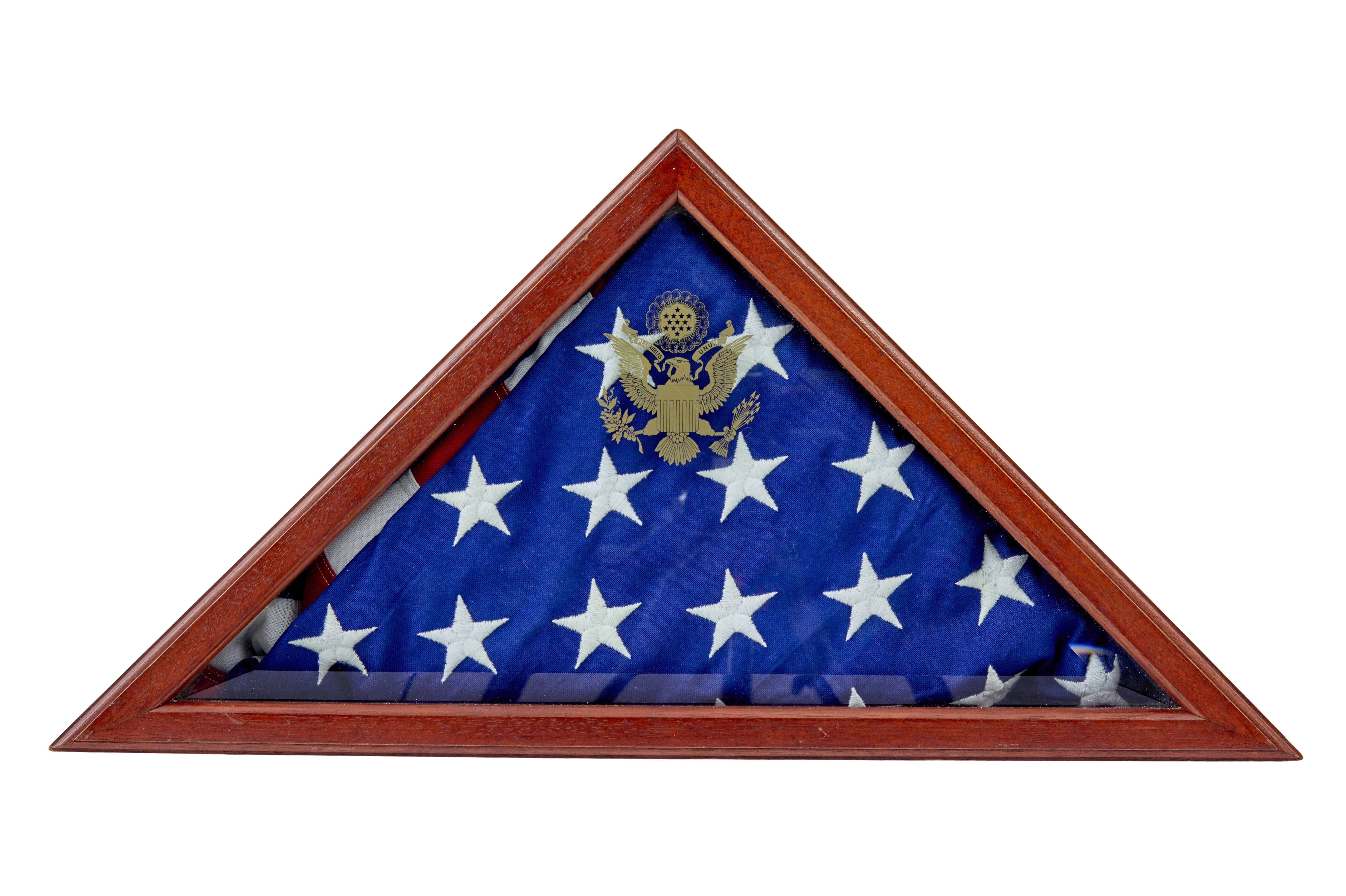 Here we present a traditionally folded American flag in glazed cabinet.

Complete with certificate to say that the flag was flown over the capital and presented by the architect of the capitol to commemorate the birth of the child on the