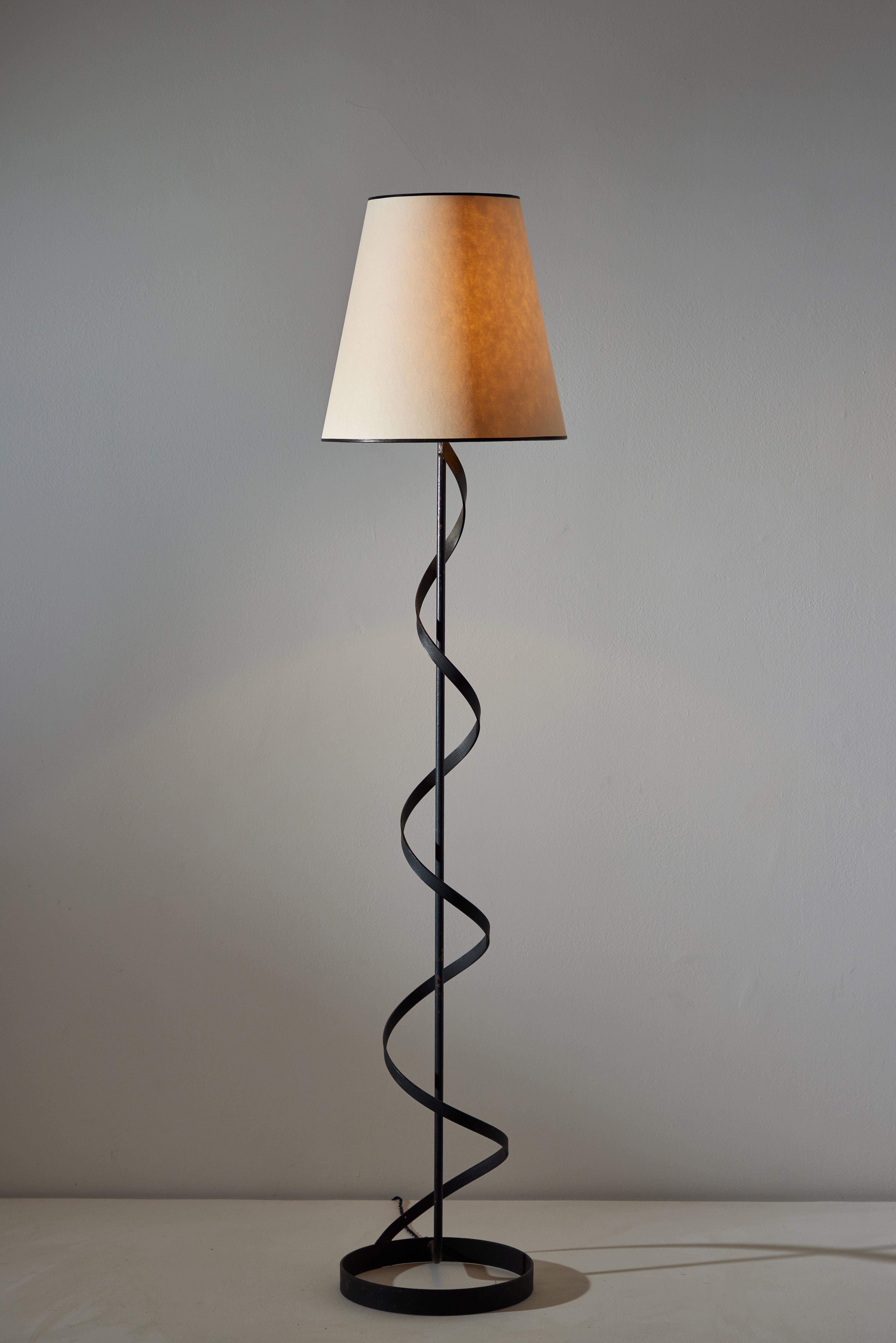 Floor lamp manufactured in the U.S. circa 1950's.  Custom parchment shade, silk trim, painted metal. We recommend one E26 60w maximum bulb. Bulb provided as a one time courtesy.
