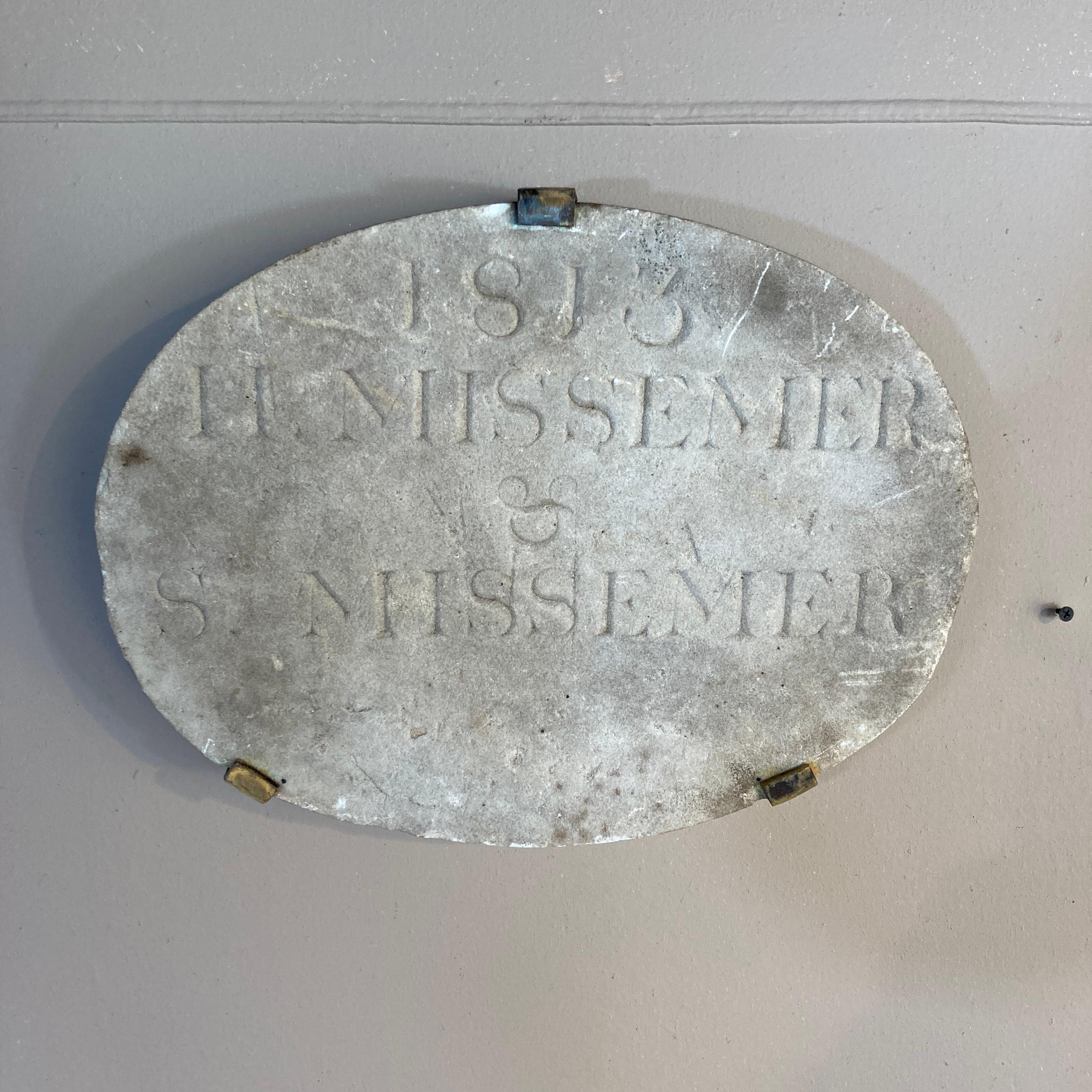 A haunting and unusual American carved marble building marker, probable New England origin circa 1813. The names inscribed are H. Missemer & S. Missemer. It is in entirely original condition, and the surface exhibits two centuries of weathering. We