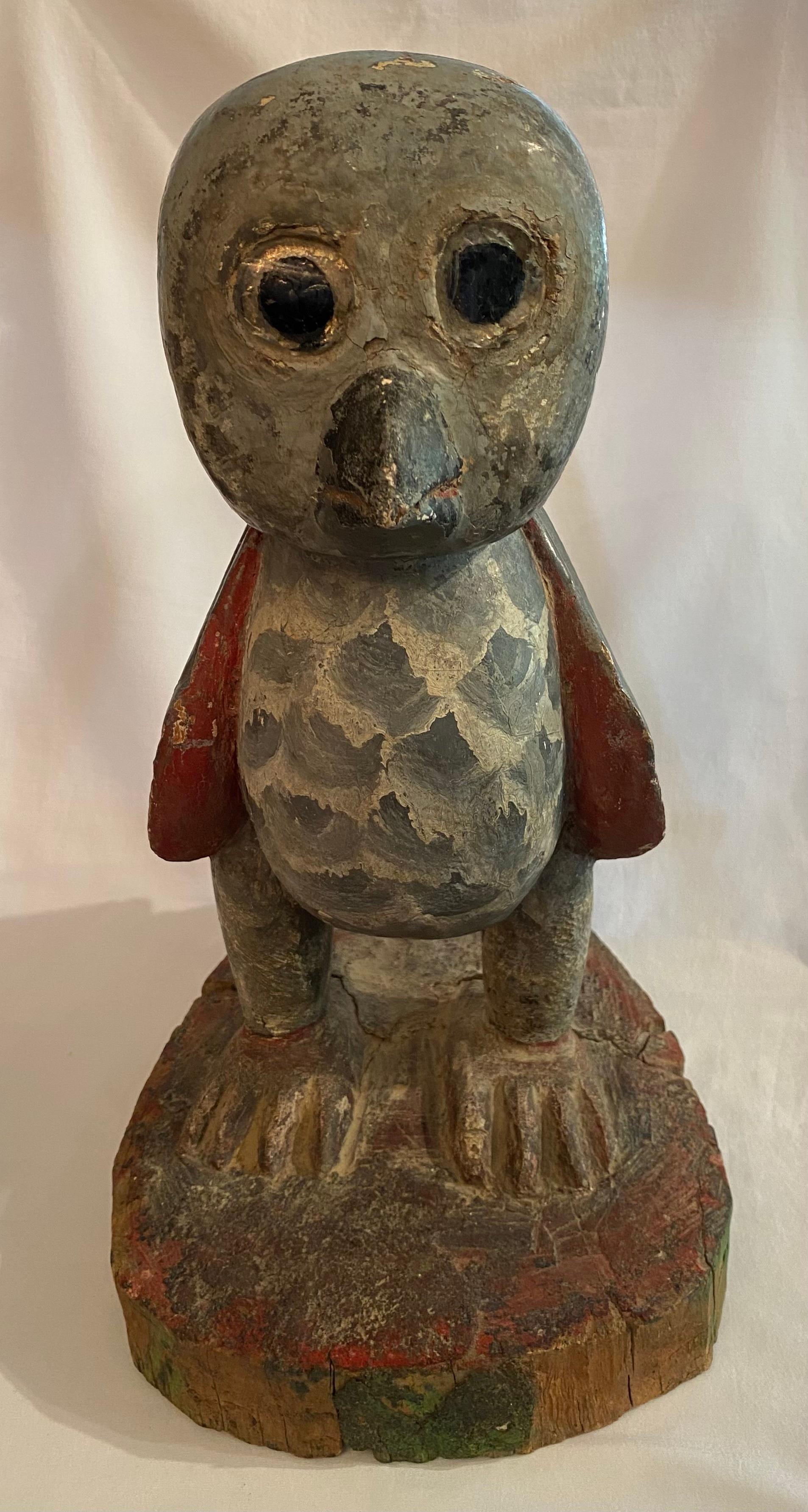 Elevate your decor with the 15-inch tall Painted and Decorated Wooden Owl Statuette. Handcrafted from wood, it combines intricate detailing with vibrant colors, adding a touch of natural beauty to any space. American folk art hand carved 1940


