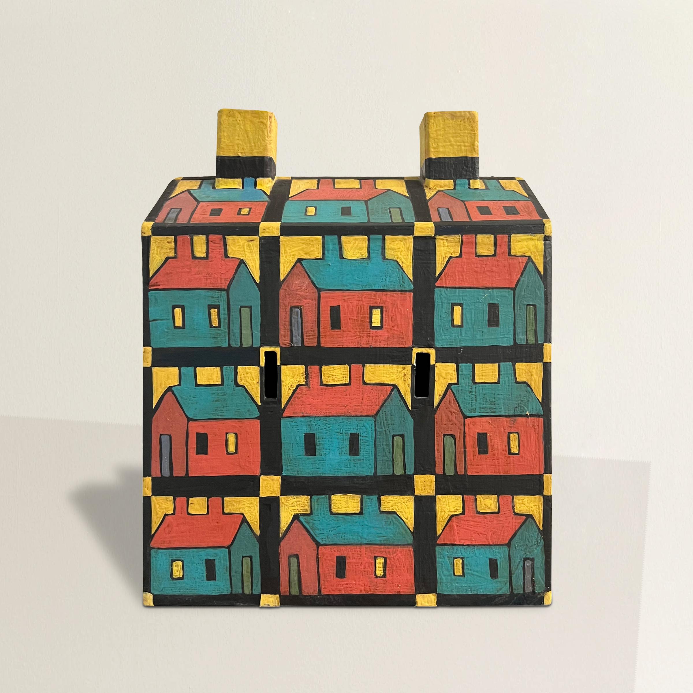 Embark on a journey through color and creativity with this 20th-century American Folk Art sculpture, a whimsical homage to the Chicago Imagist style, evoking the spirit of visionaries like Roger Brown. The house is a kaleidoscope of hand-painted