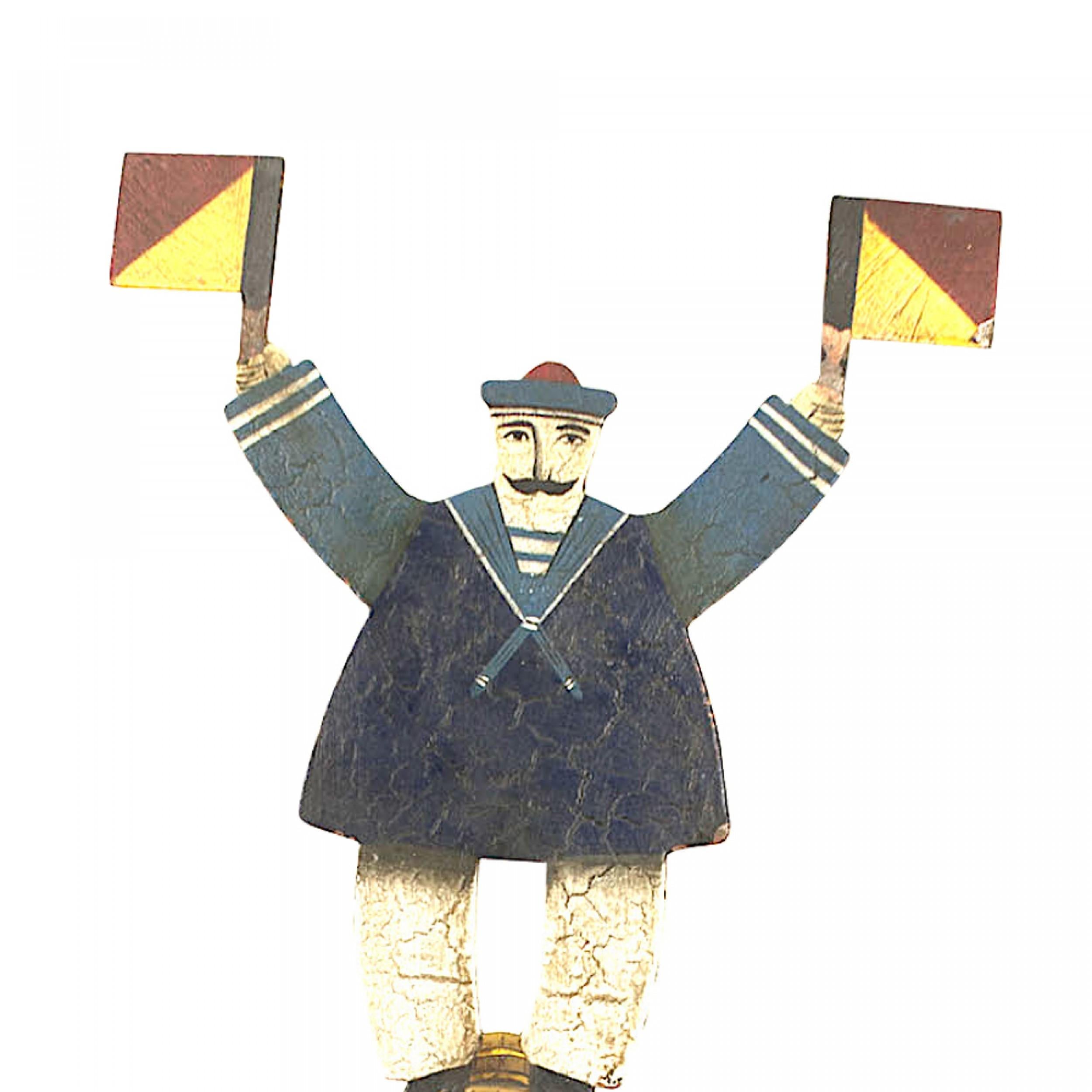 Amerikanisches Land (19./20. Jahrhundert) Folk-Art-Skulptur eines bemalten und verzierten Seemanns, der zwei Flaggen hält, montiert auf einem eisernen Waagebalken.