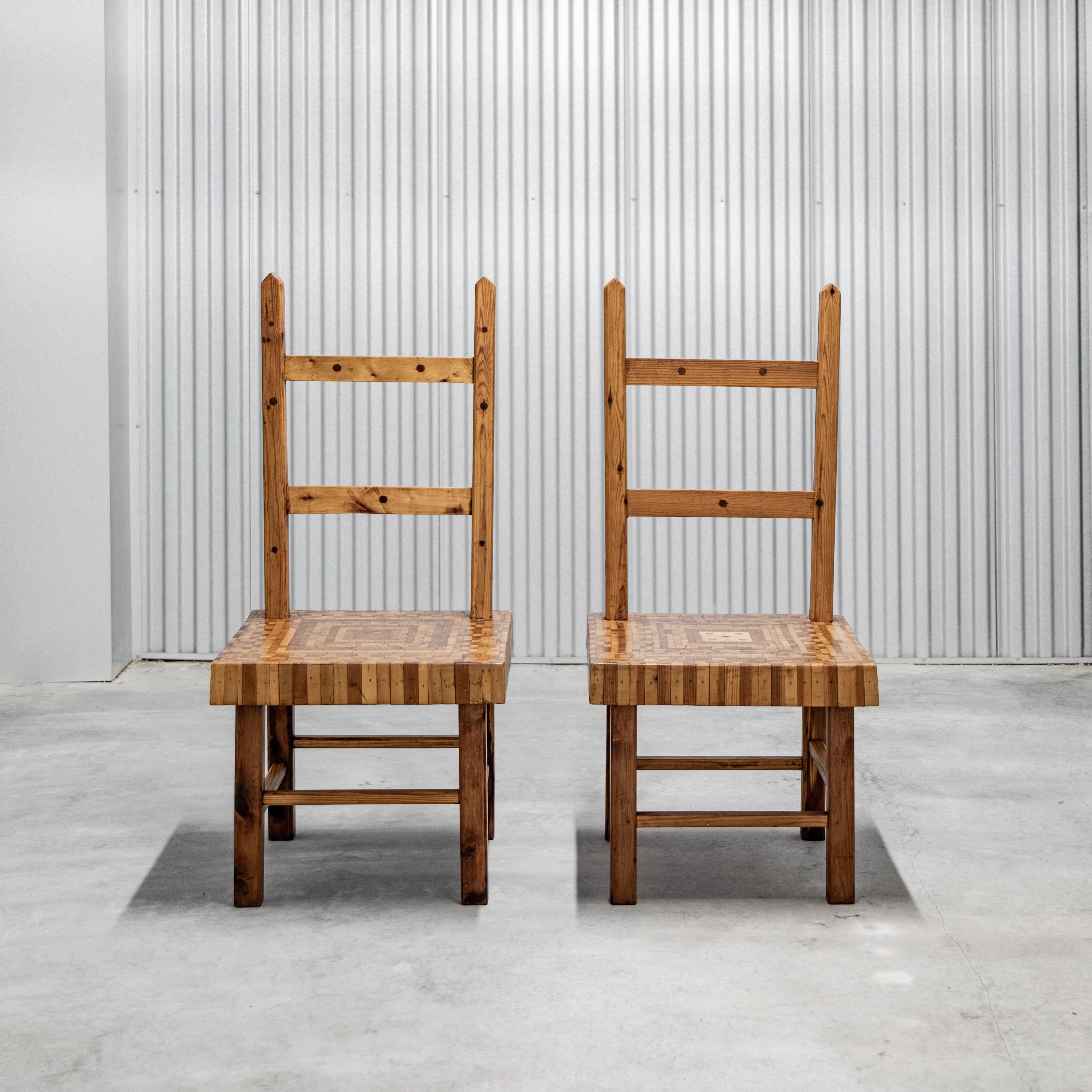Pair of American folk art ladder-back chairs with parquet seats.
