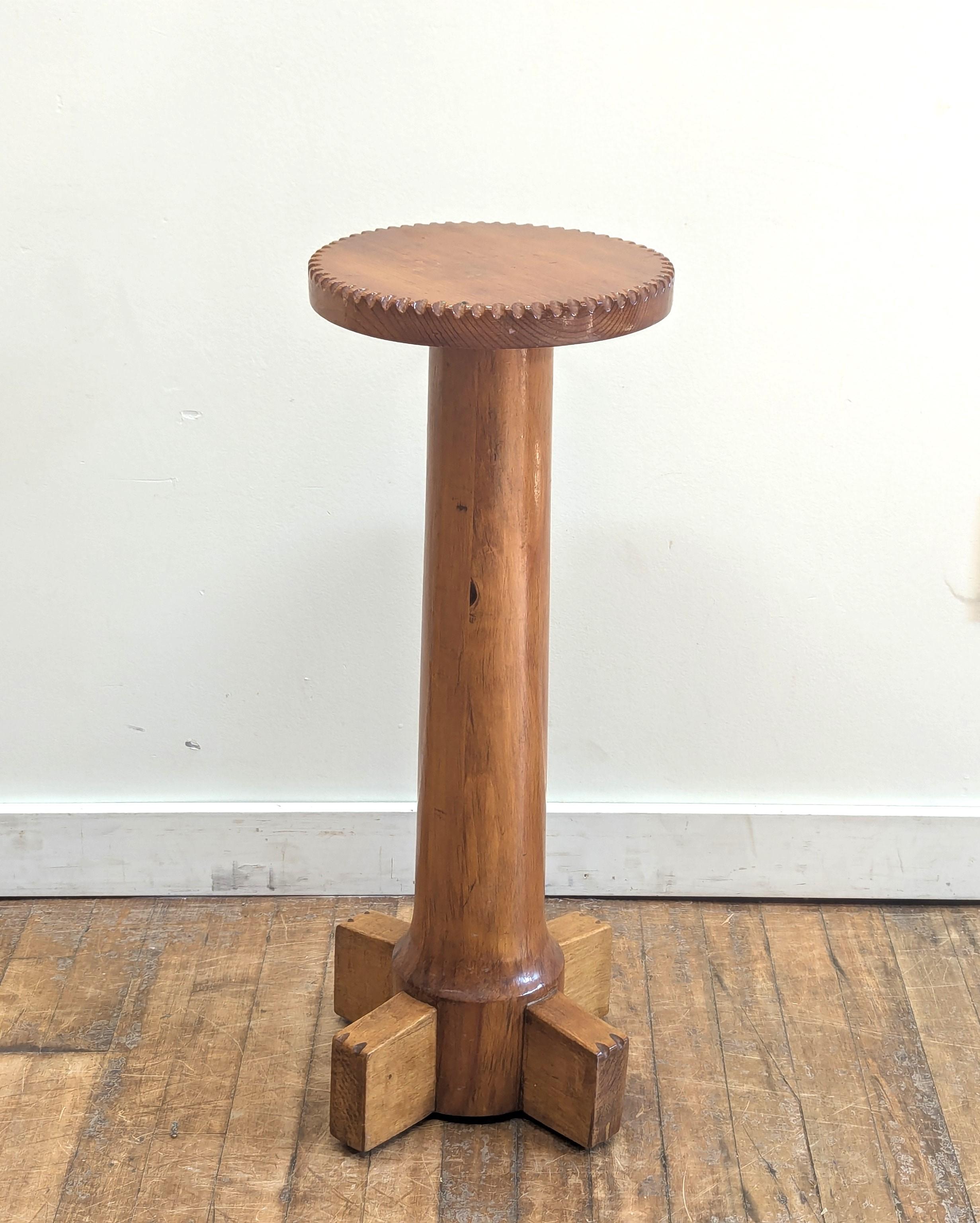 American Folk Art Pedestal Table.  Wonderful Folk Art Pedestal side table.  Carved cog style edge to the top with similar detail to the top of the feet.  Slight tapper from top to slightly thicker bottom with sloped wider bottom presenting four