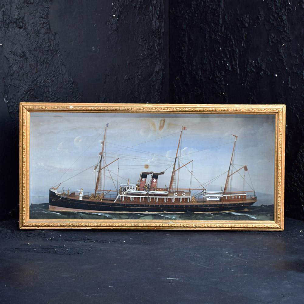 American Folk-art Steam Ship Encased Diorama

We share what we love, and we love this turn of the century hand crafted American folk-art encased steam ship model, created from a variety of found objects, including metal, fabric, and wood. The
