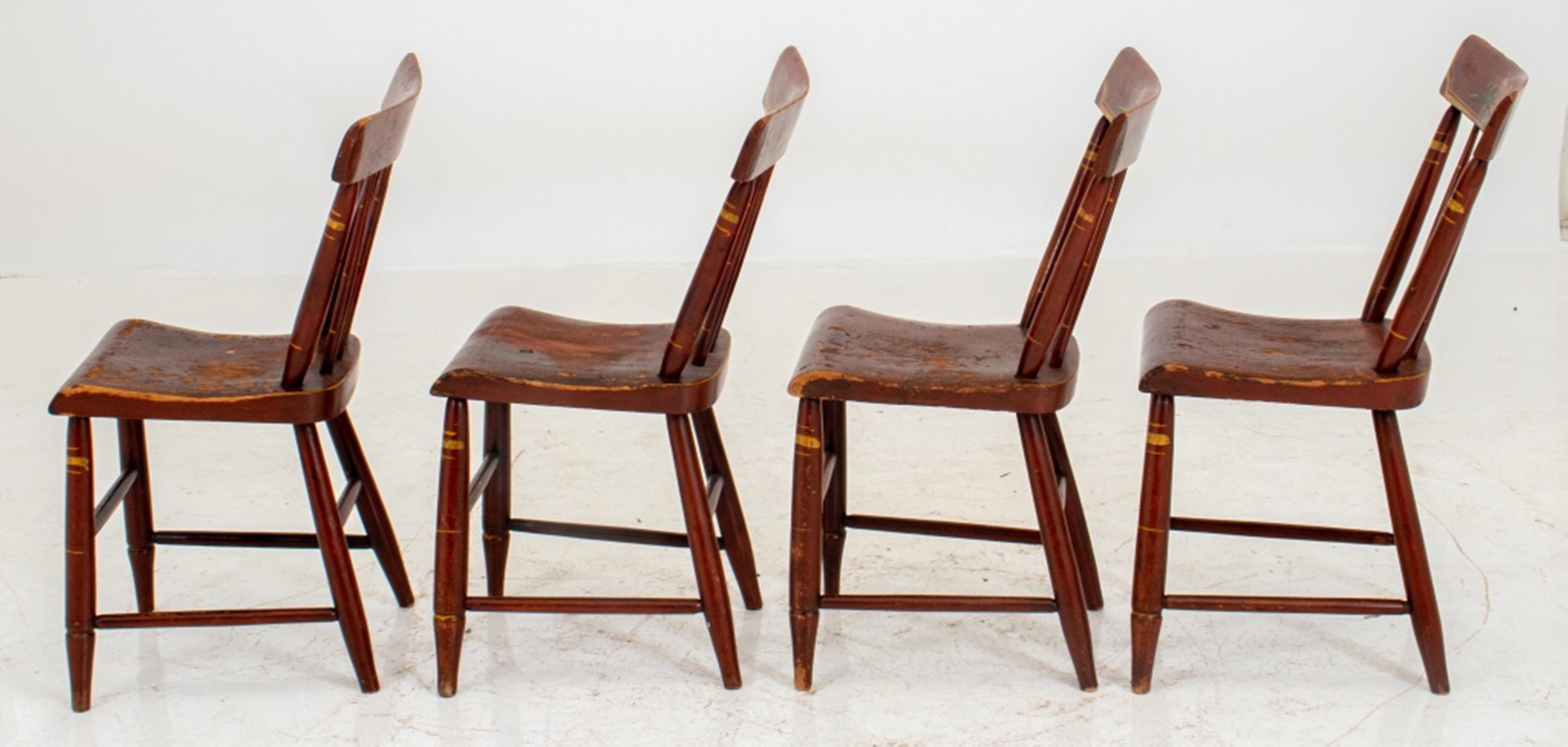 American Folk Art Style chairs, four (4), each with rectangular backrest, red painted ,and with floral motifs above two dowel supports and three turned splats, the shaped seat similarly painted and on four turned legs with stretchers. Measures: 31