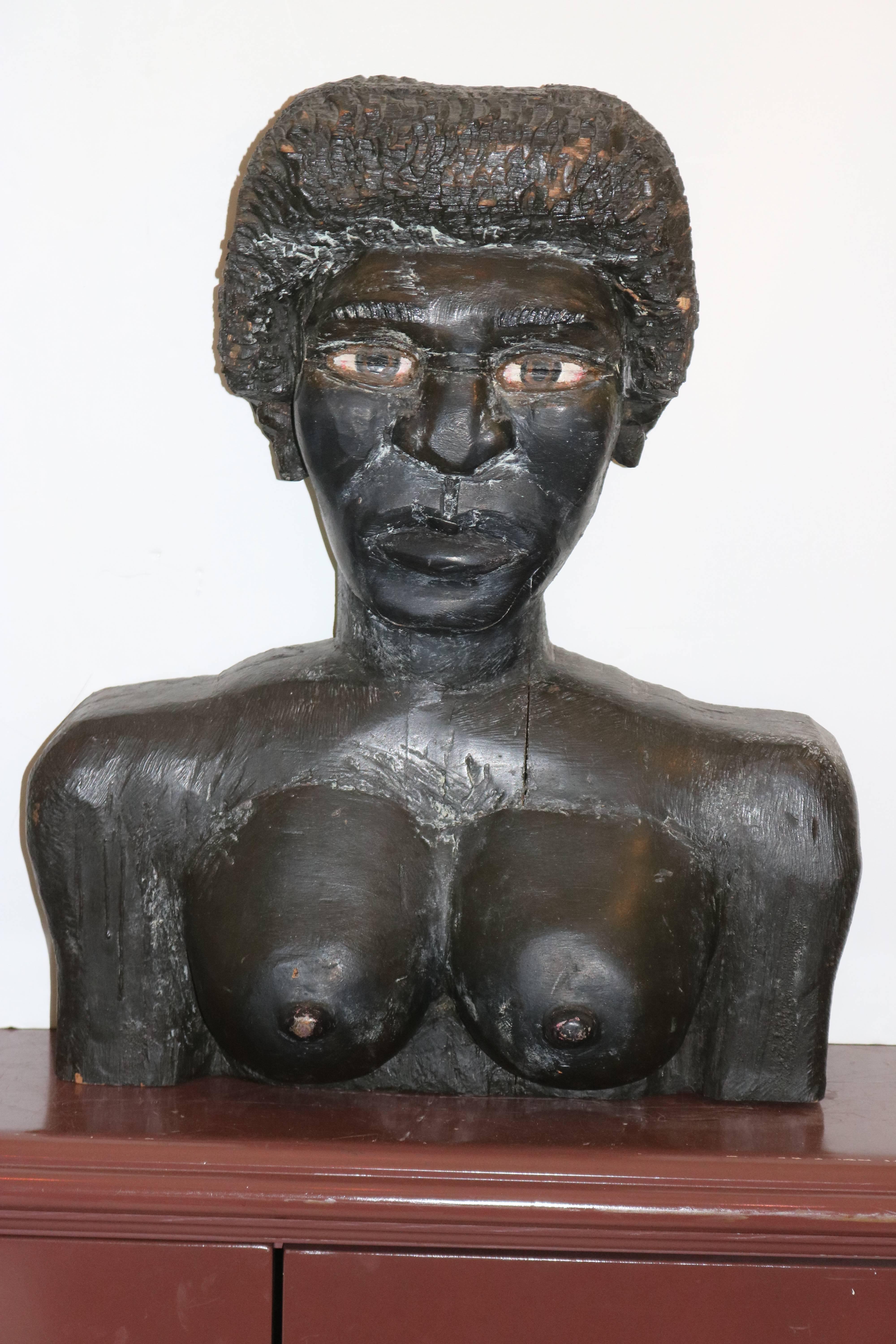 A mesmerizing Very Large Powerful poignant pair of Outsider American Folk 
Art black male and female wood hand carved busts sculpture. Most extraordinary that we have ever seen. To view them is to be impressed with the naive self taught skillful