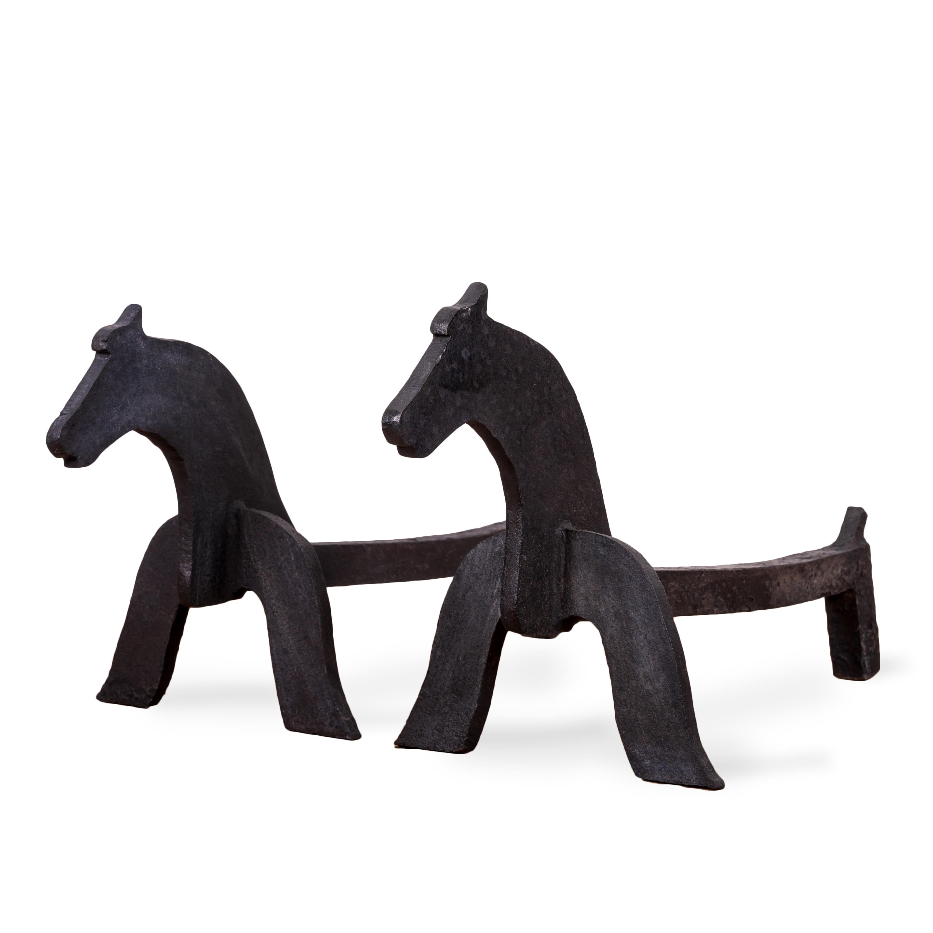 A pair of American folk art wrought iron horse andirons, early 20th century.



9 ½ inches wide by 23 inches deep by 11 ¾ inches tall



