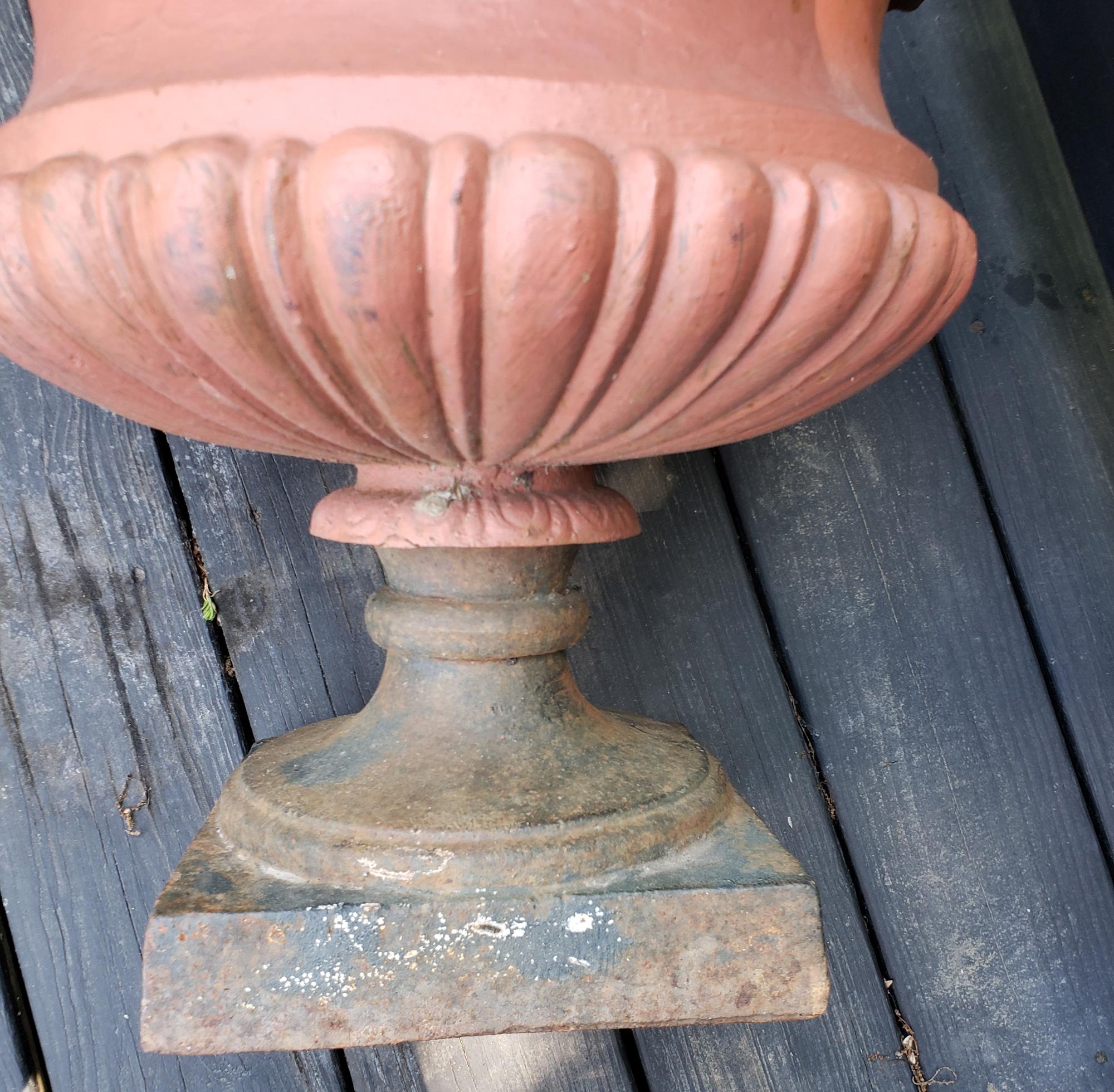 Time for planting.

American cast iron garden urns, Set of four, circa 1900

The American painted cast iron set of garden urns are painted with a blue and the body with an ochre body. The urns have a square pedestal foot with a circular