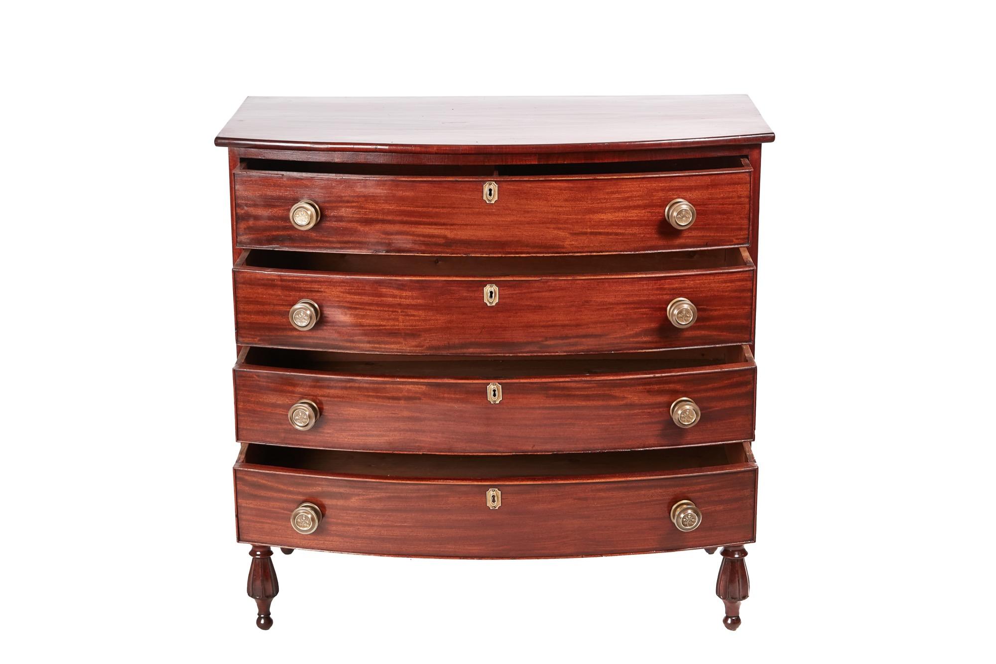 Fine American antique mahogany bowfront chest of drawers having a lovely quality bow front top, four long drawers with brass handles, shaped apron supported by four unusual shaped turned feet.

In excellent condition - exceptional color.
 