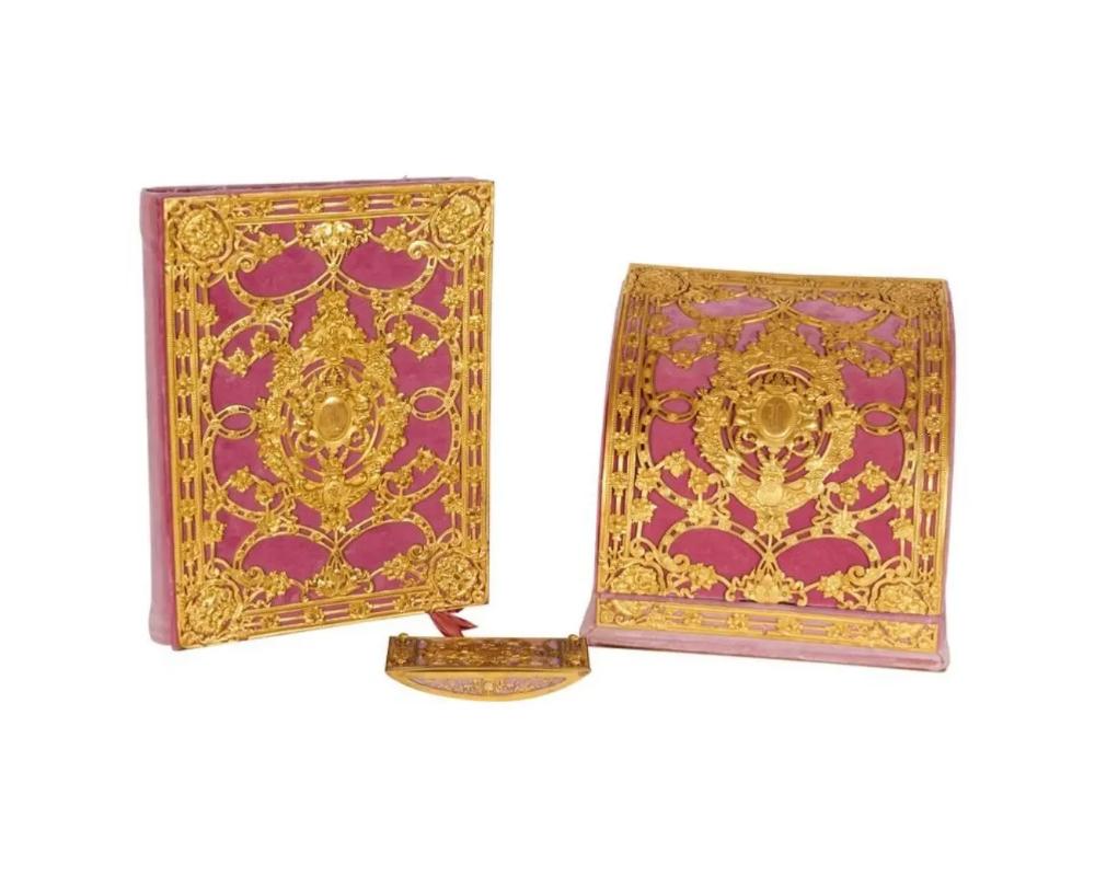 A very fine three-piece gilt bronze-mounted pink velvet desk set by Edward F. Caldwell & Co.

Comprising of a folio, ink blotter and letter box.

Folio: 16